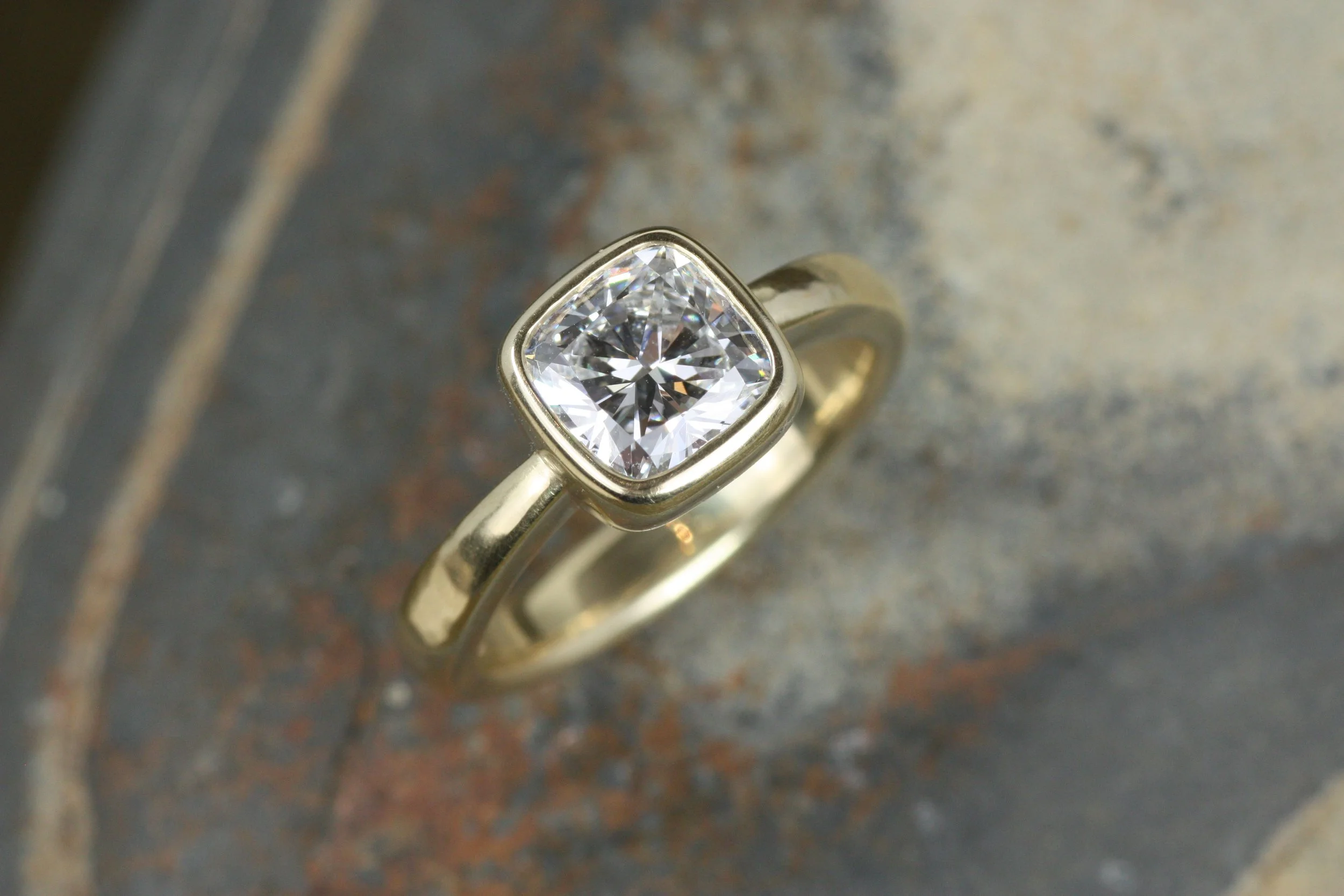 cushion cut lab diamond bezel engagement ring