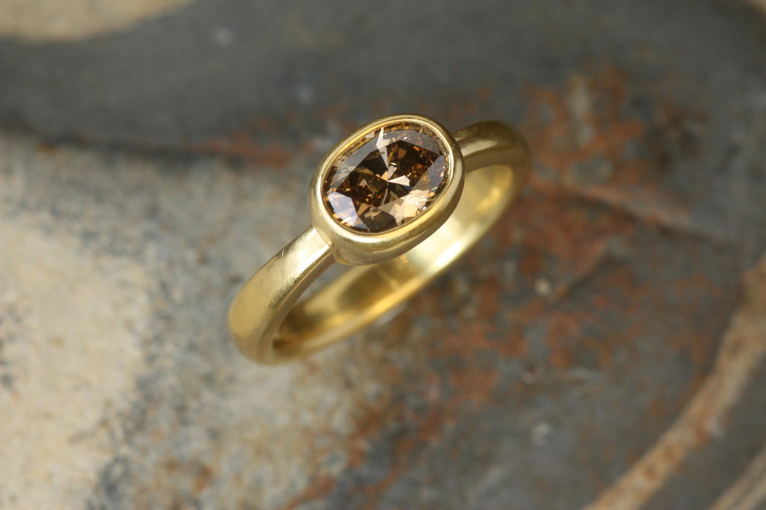 oval brown diamond bezel engagement ring