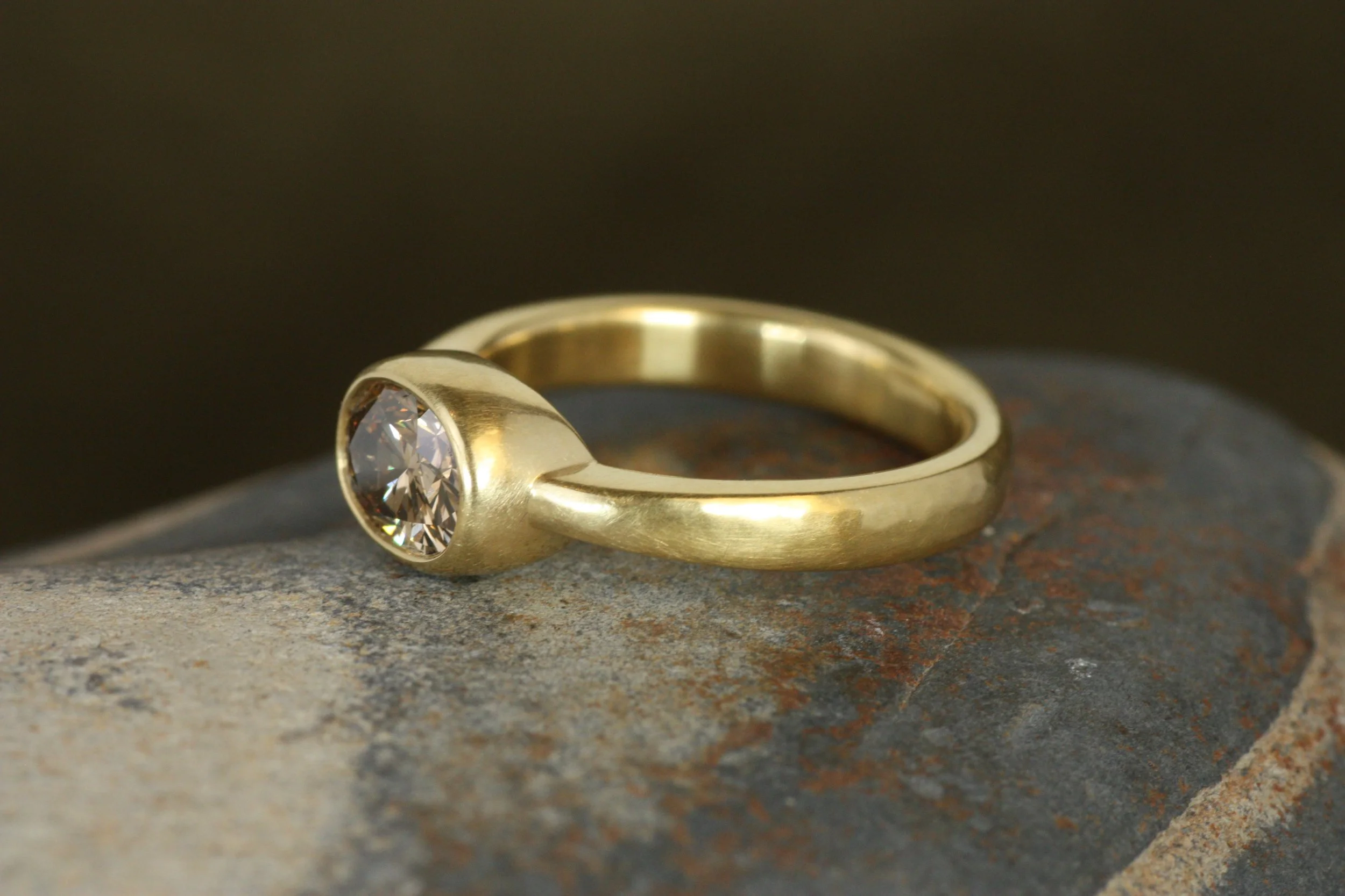 oval brown diamond bezel engagement ring
