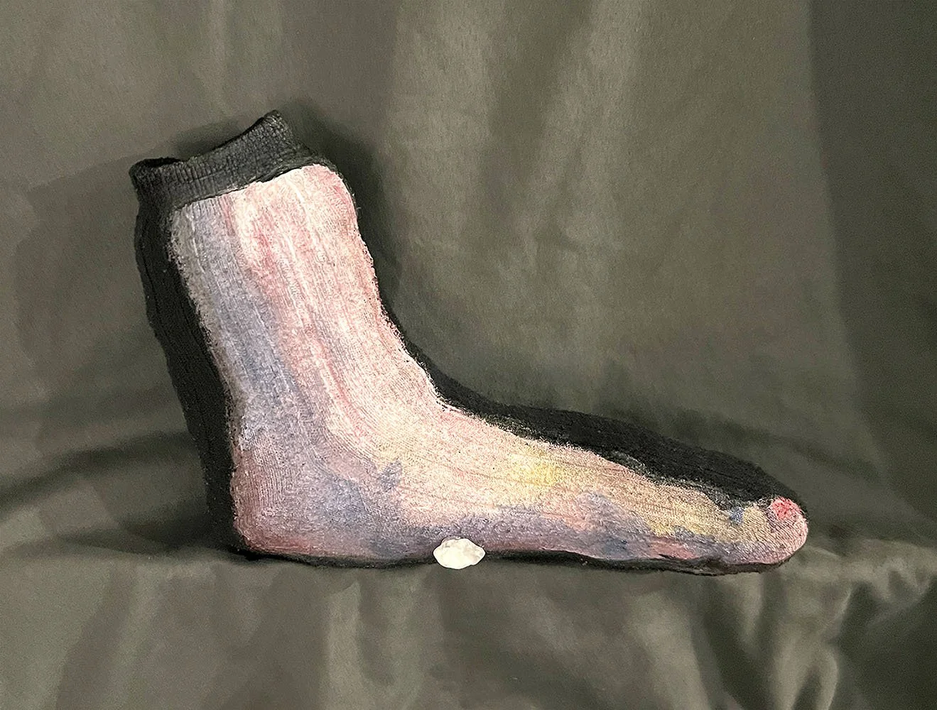Emma Rarick. "Running with a Rock in my Sock," January 2026, acrylic on stuffed sock.