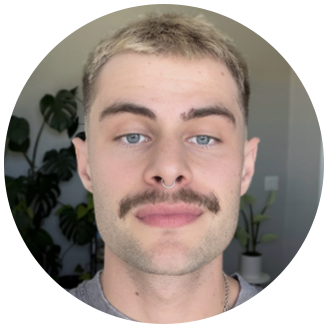 Photo of Trevor Carroll- white man with short blonde hair, mustache, and septum piercing