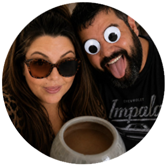 Photo of Jen & Mike- White woman with long brown hair smiles with sunglasses and a cup of coffee, while white man with short brown hair and his tongue out poses with silly cartoon eyes over the top of his eyes.