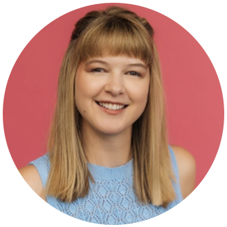 Photo of Kaelynn Partlow- white woman with long blonde hair smiling in front of a pink backdrop.