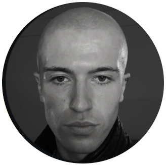 Photo of Luke Grosch- white bald man with serious expression