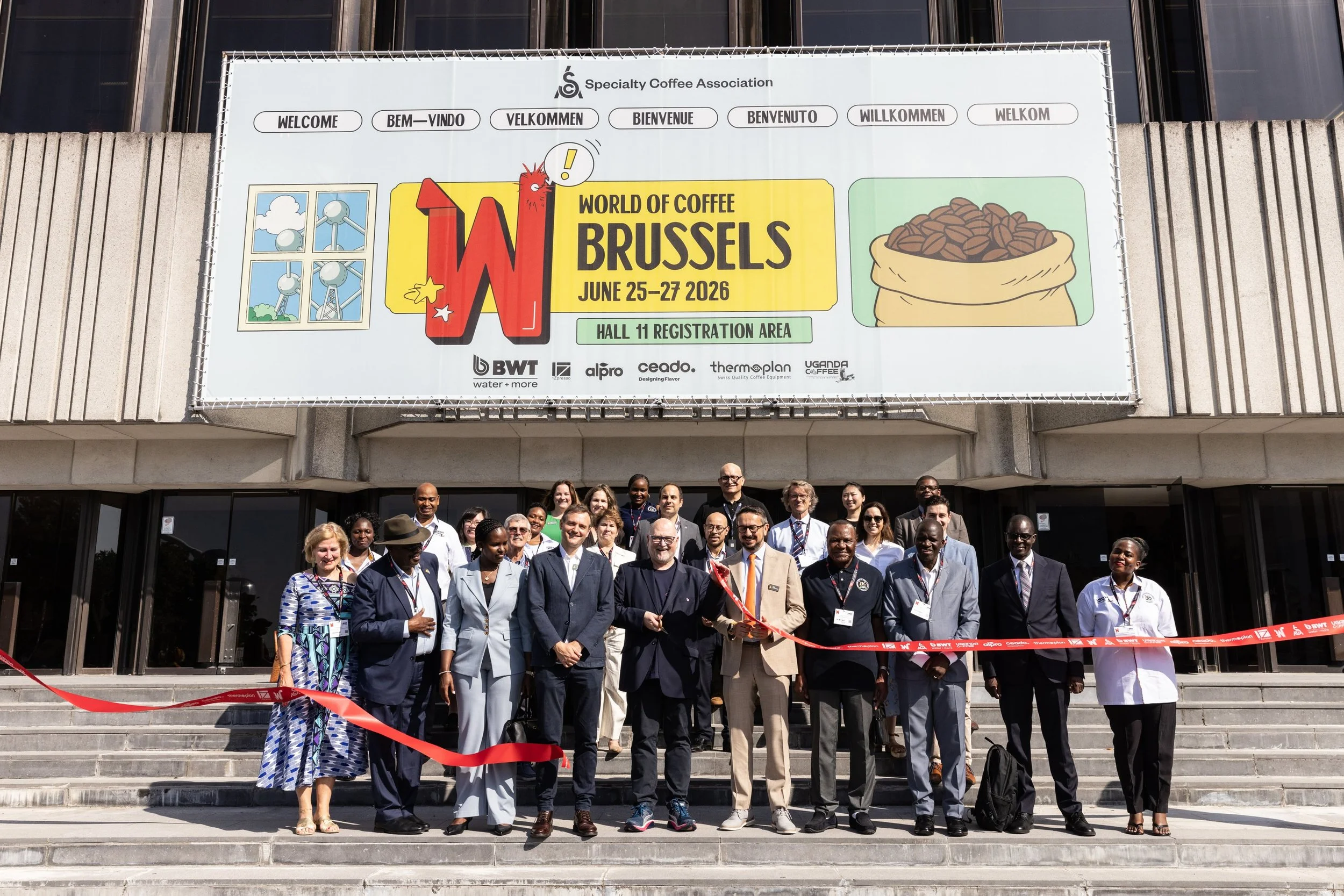 Opening of World of Coffee Brussels on steps of Brussels Expo cutting ribbon