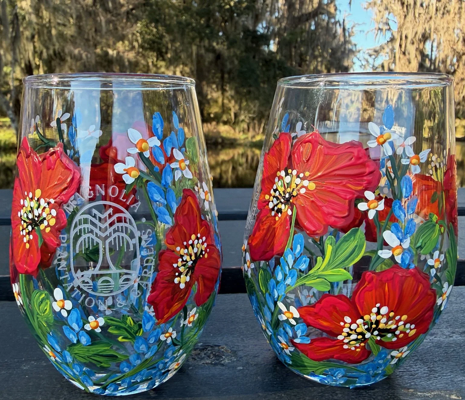 Poppies and wildflowers on a stemless wine glass