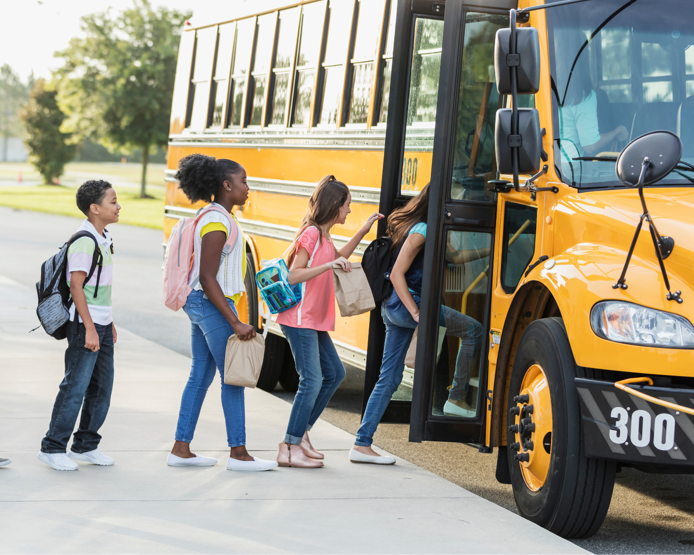 Kids getting on a school bus on their way to Magnolia Plantation & Gardens for a field trip