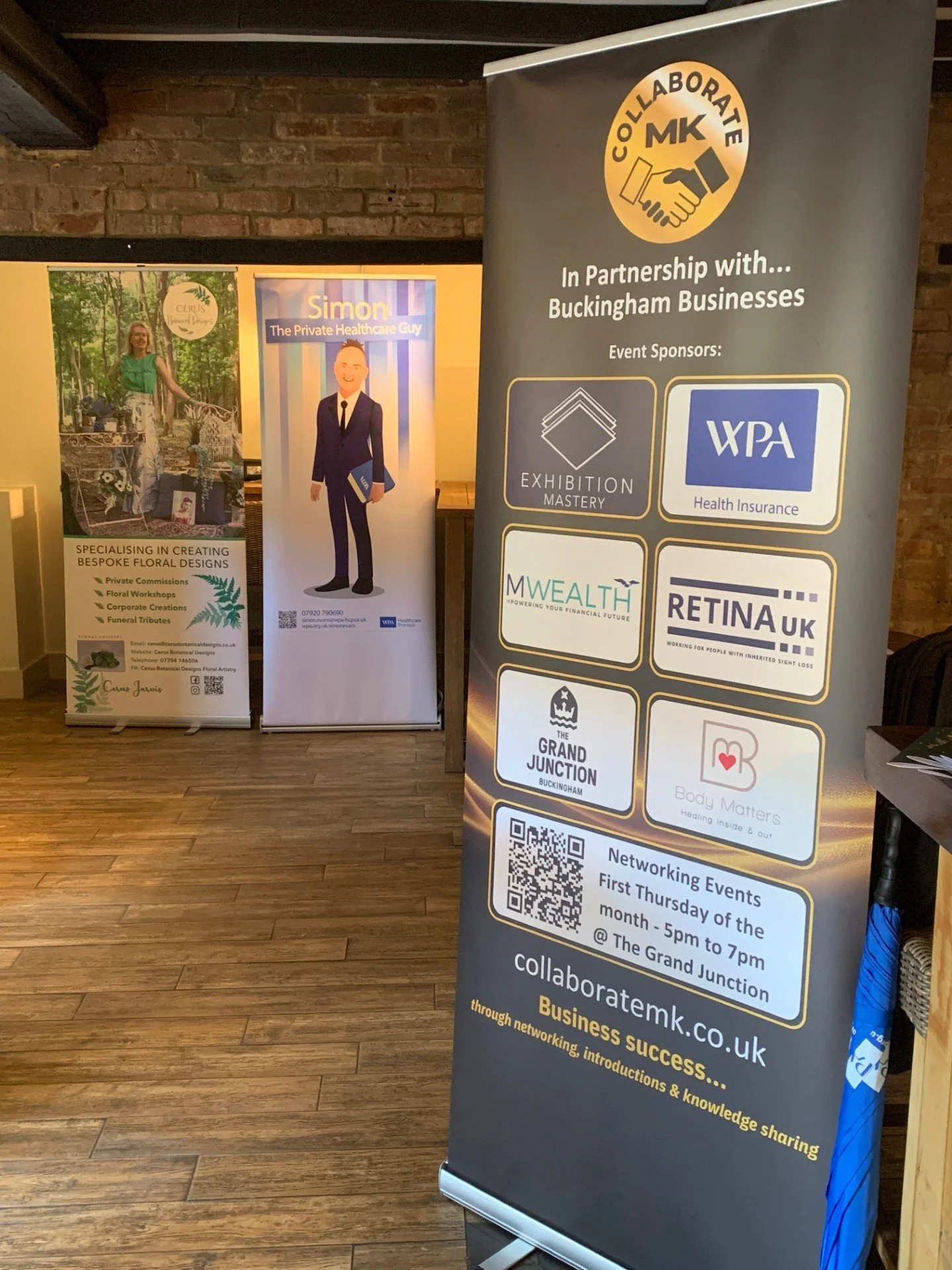 A vertical banner promoting networking events in partnership with Buckingham Businesses, featuring event sponsors: Exhibition Mastery, WPA Health Insurance, MWealth, Retina UK, The Grand Junction, and Body Matters. The banner includes a QR code and details of the events held on the first Thursday of each month from 5 pm to 7 pm at The Grand Junction.