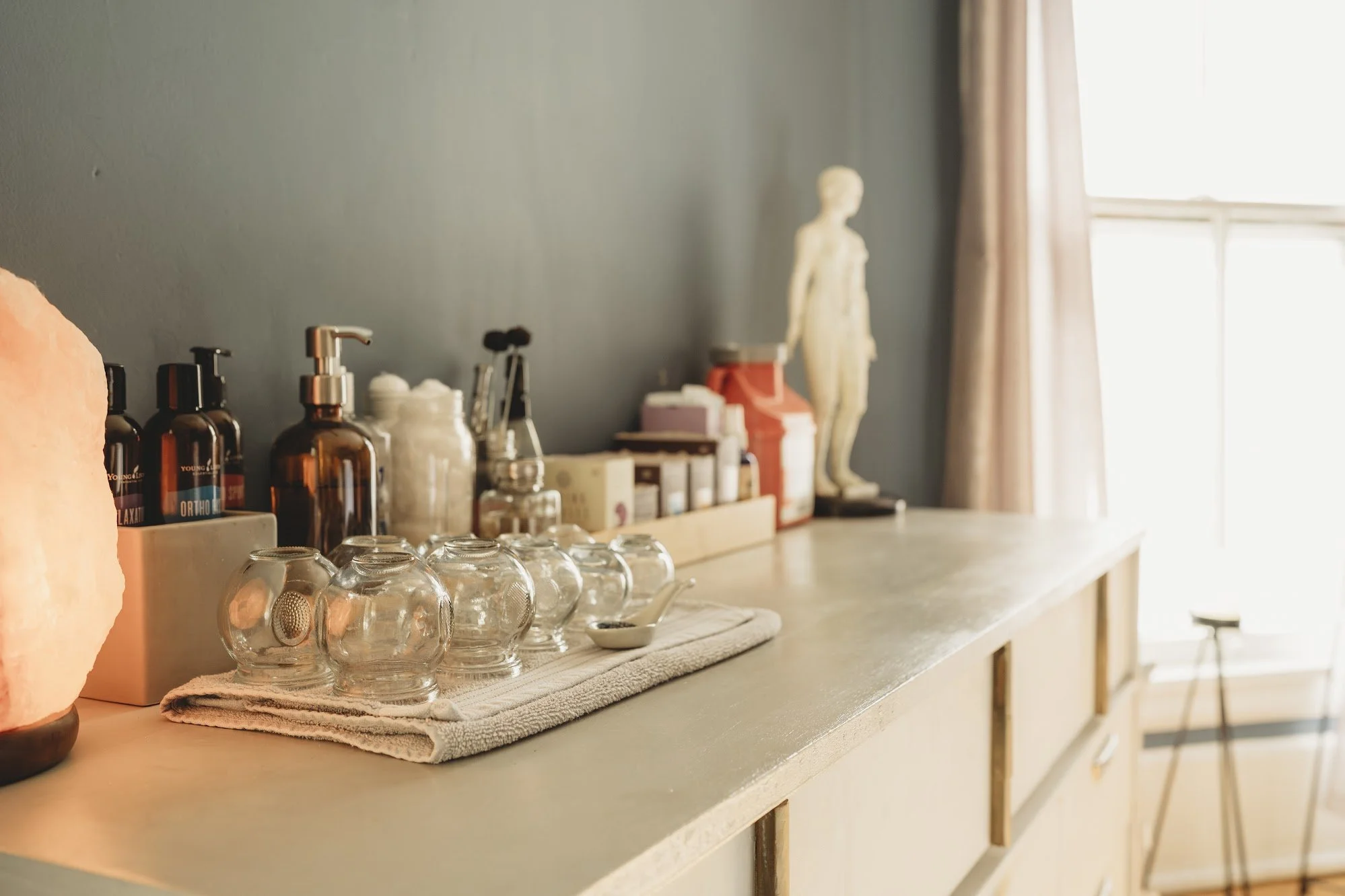 Acupuncture treatment setup and Cupping therapy tools used in Traditional Chinese Medicine at Essence Healing in Corning NY