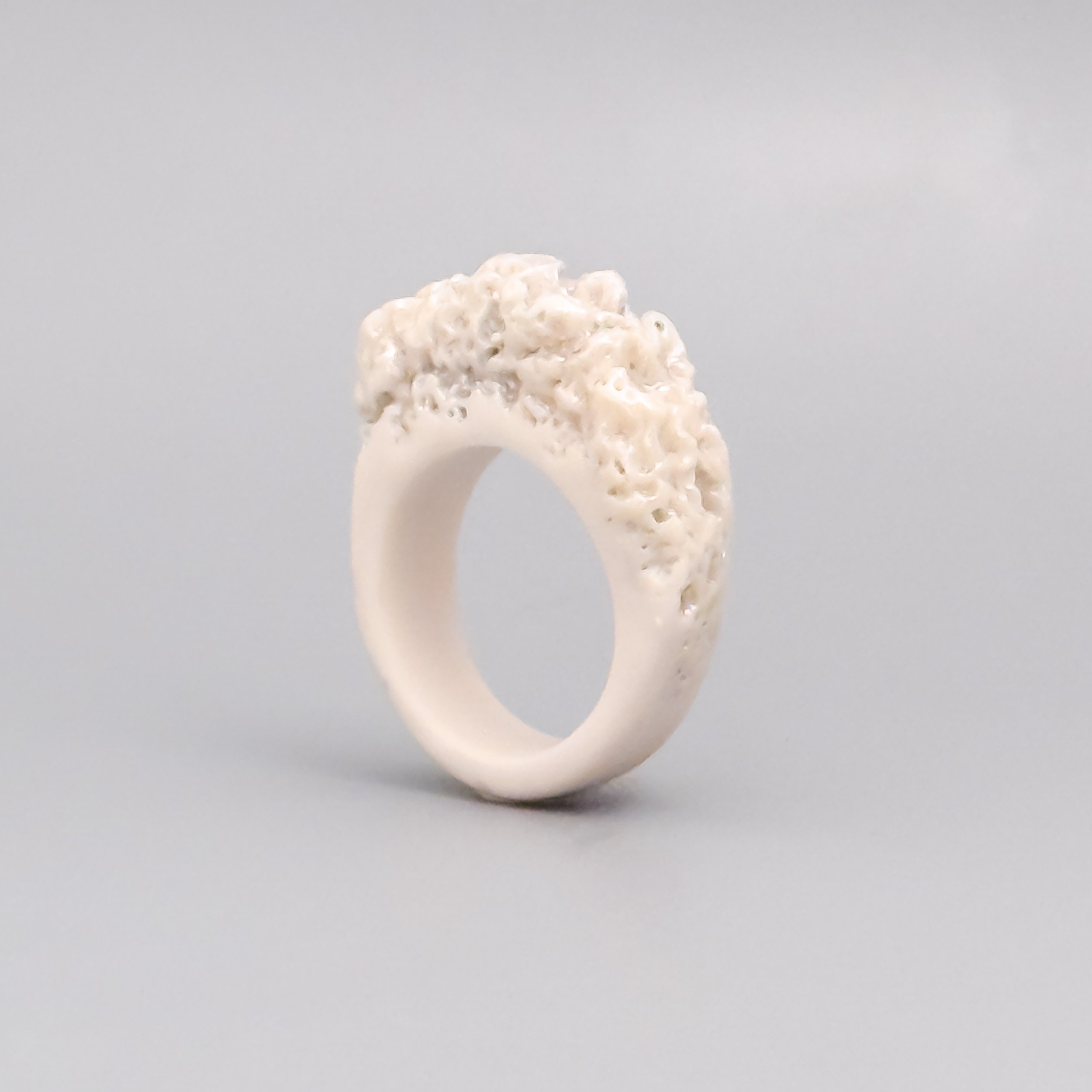 Artisan porcelain ring featuring coral texture and soft luster – handcrafted in Brooklyn with Limoges clay
