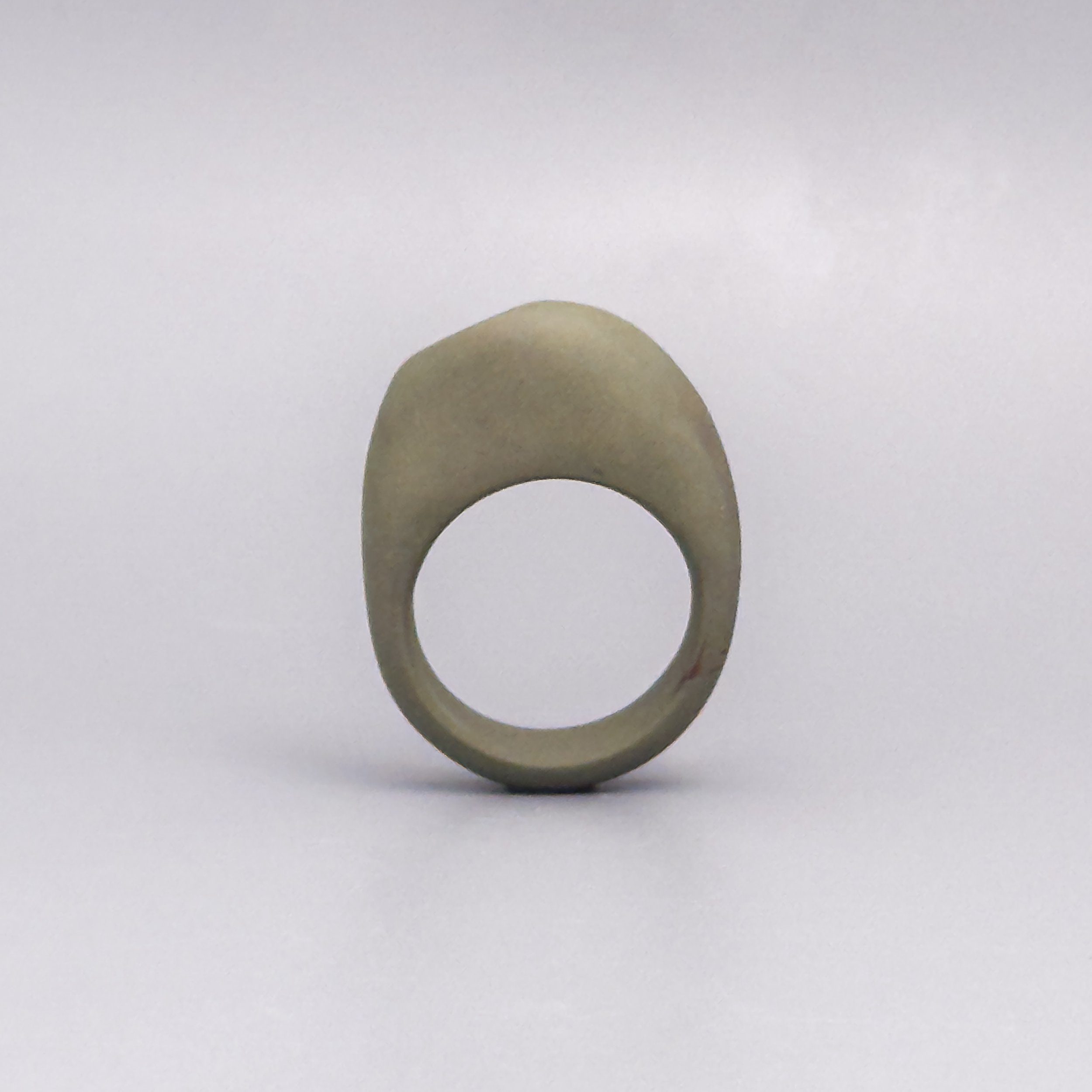 Hand-sculpted ceramic ring with matte porcelain and off-center copper luster