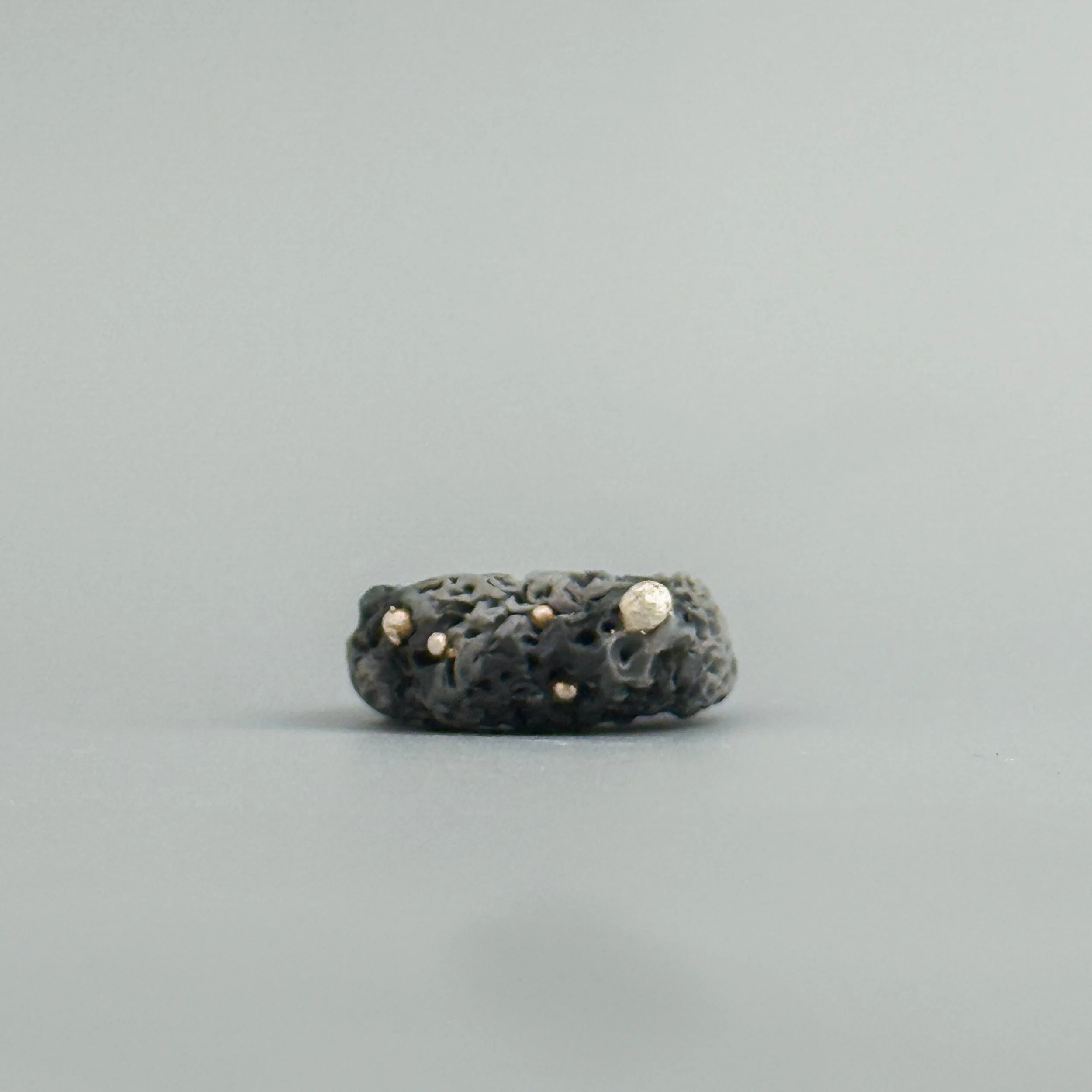 Handmade ring in dark porcelain tones with silver fused crown, allergy-friendly ceramic jewelry handmade in Brooklyn