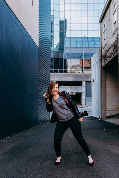 Memphis Photographer dancing in alley with camera