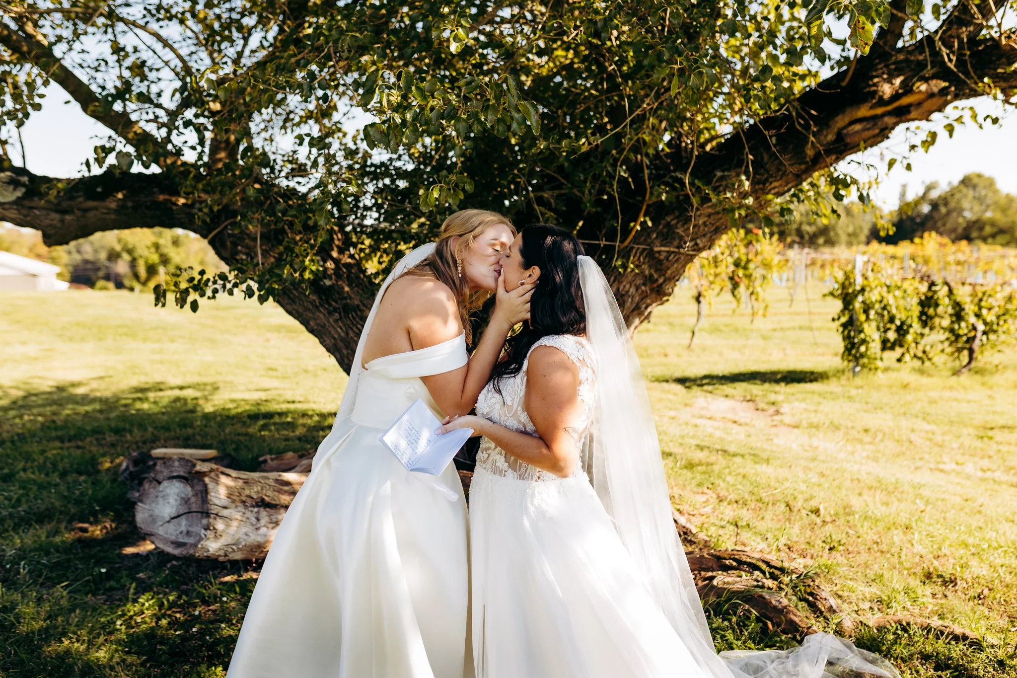 LGBTQ couple kisses during their wedding day first look