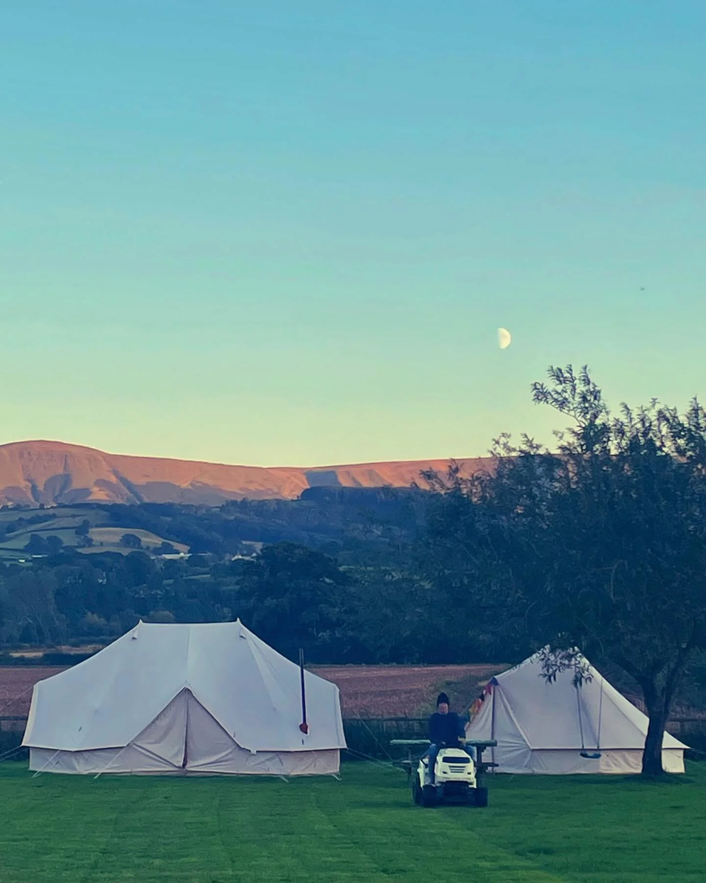 Dad mowing at dusk, what a beautiful, almost autumnal, evening. #autumncolors #haybluff #canvastents #firepitseason #cosyweather #hotchocolatetime #campinautumn