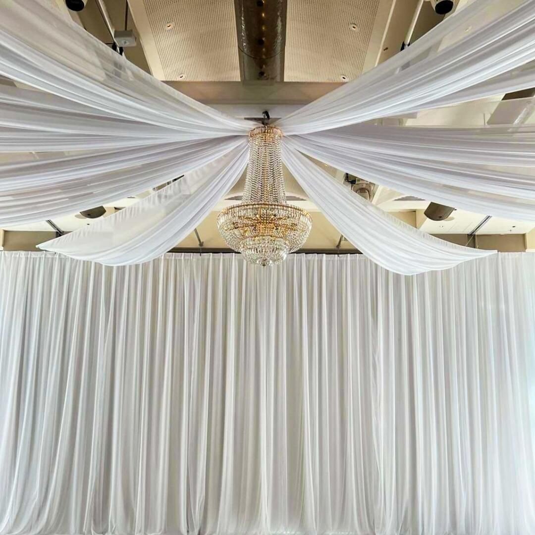 Good morning and happy Sunday! We've just been running around setting up events all over town. Don't you just love this classic white and gold styling in @crownmelbourne? This setup features our Monet chandelier in gold with soft white ceiling drapes