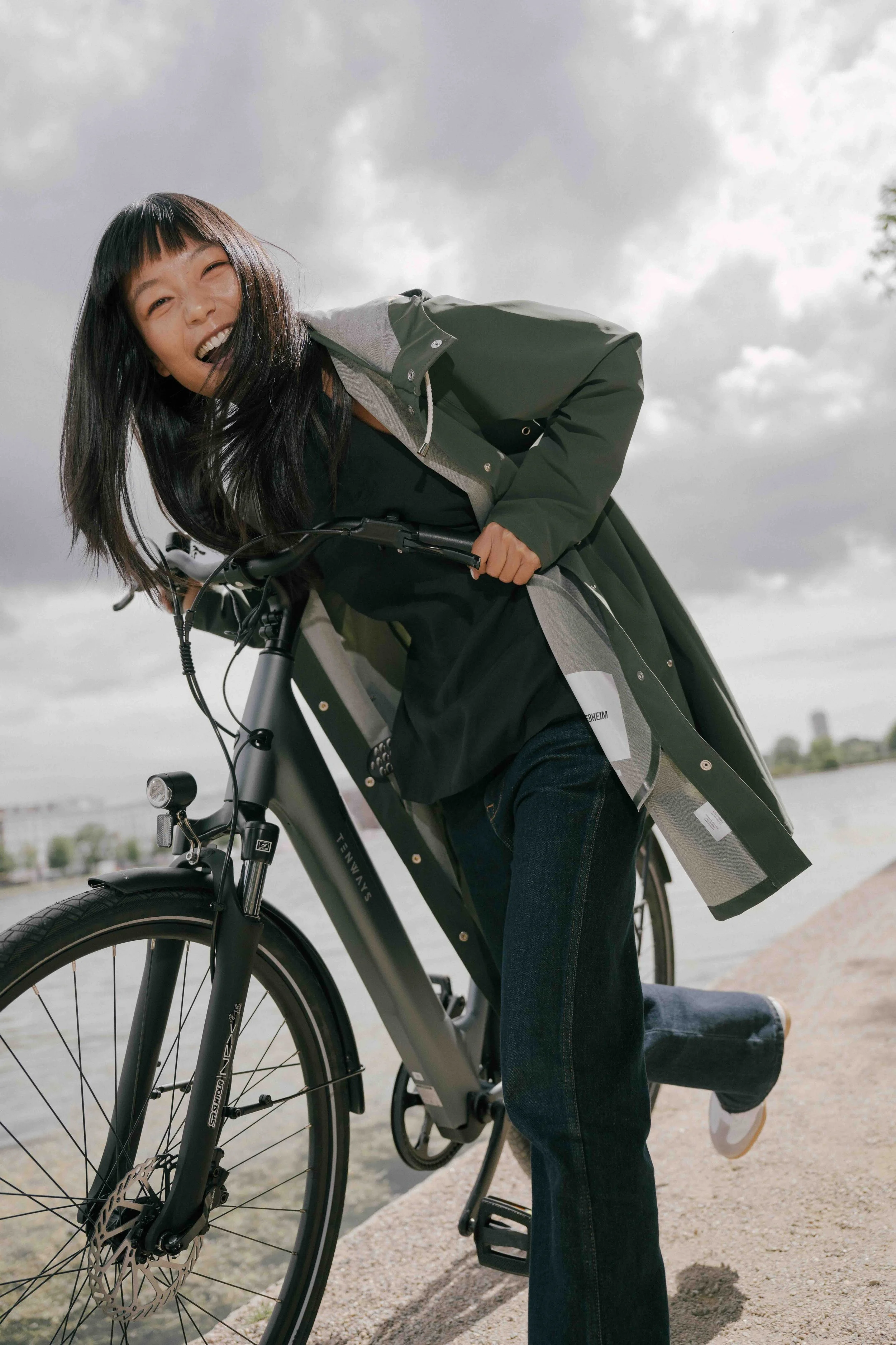 Rider with a Tenways electric bike in a Stockholm city setting