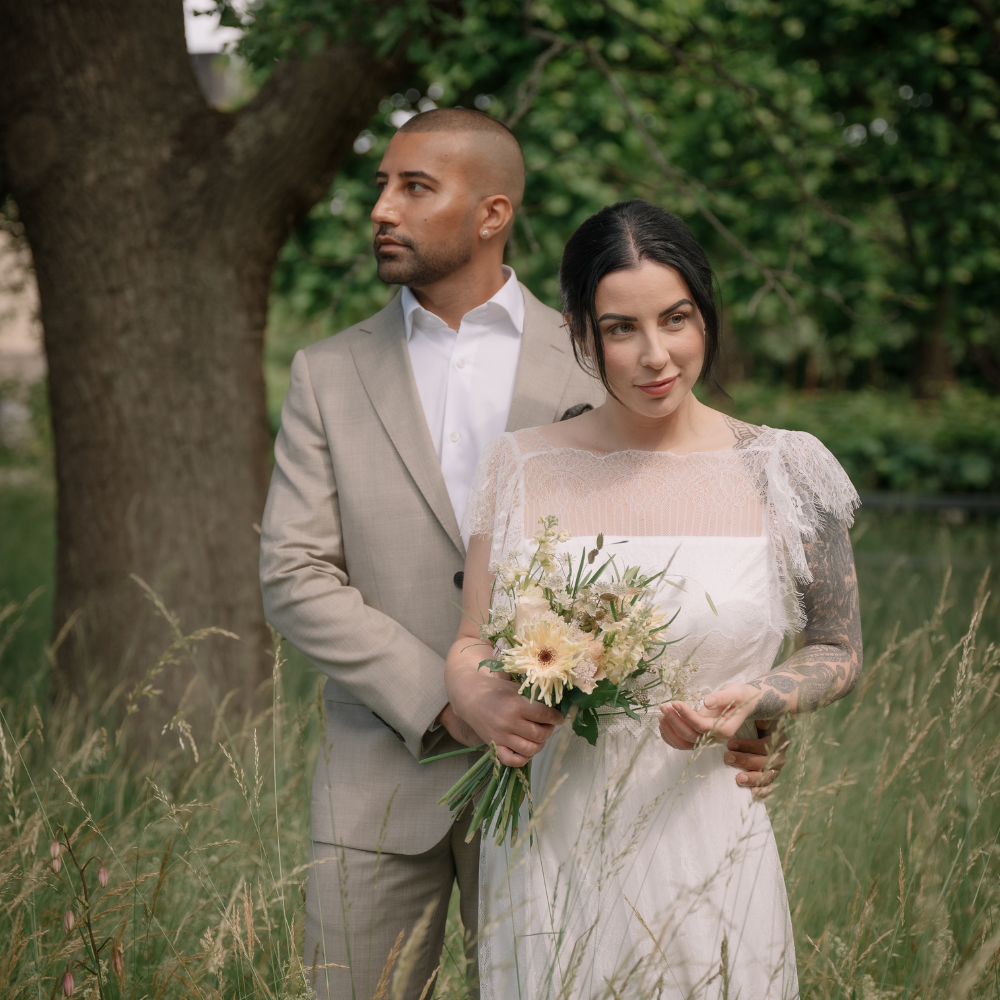 Bride and groom posing together outdoors during a wedding in Sweden