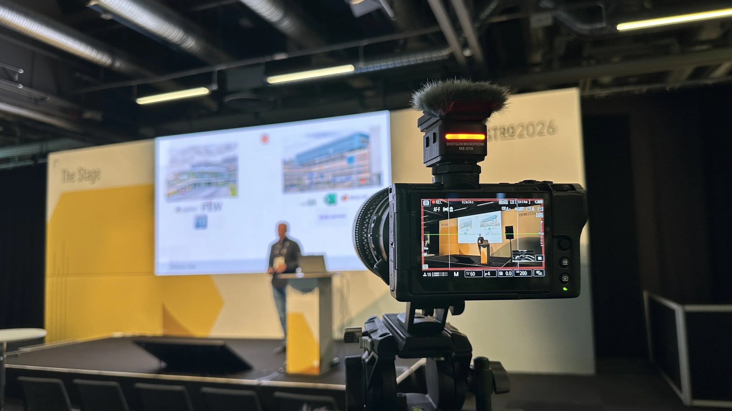 Camera filming a presentation at ESTRO 2026