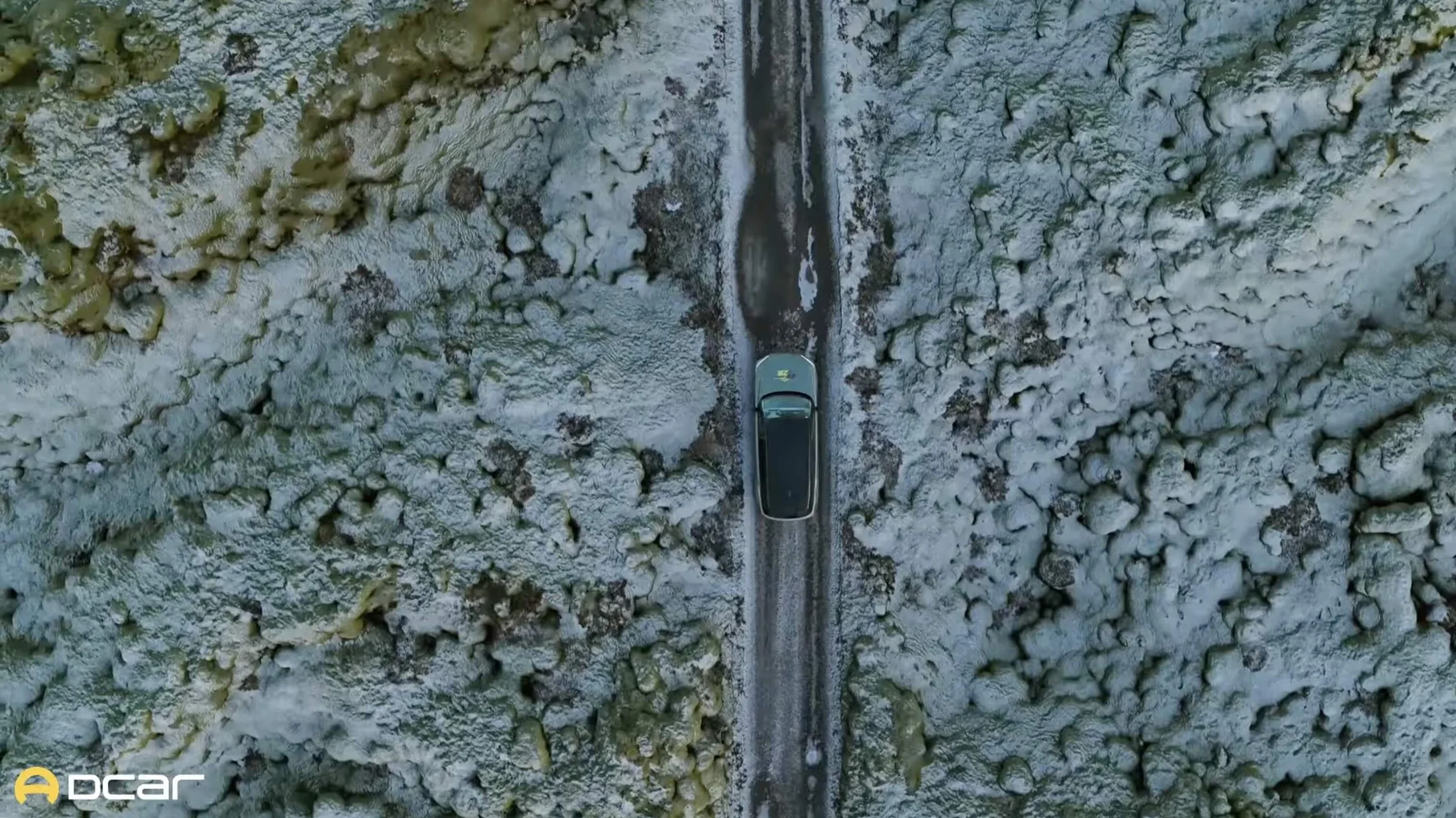 WEY electric vehicle filmed from above on a remote road in Iceland