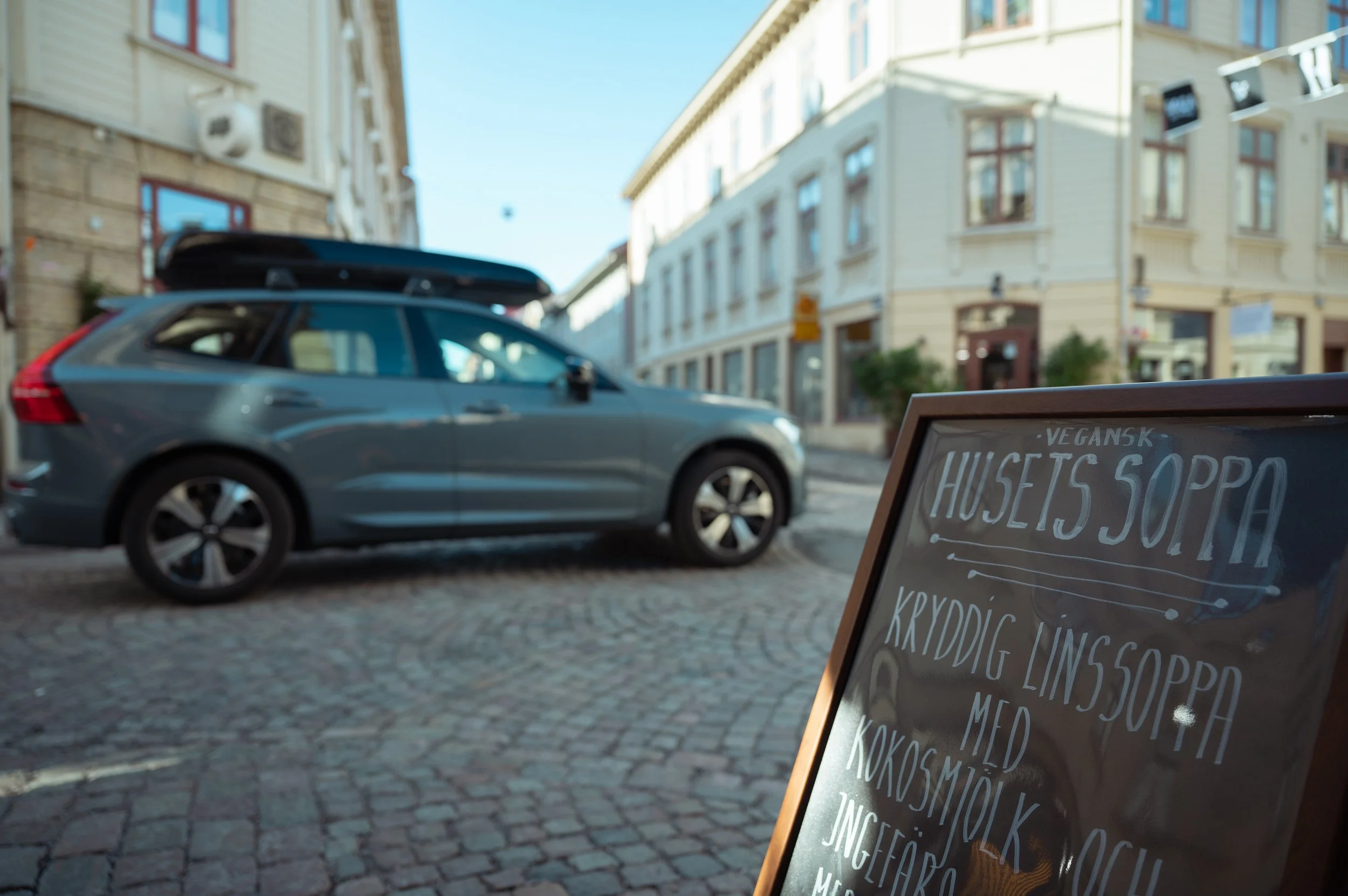 Volvo SUV photographed on a cobblestone street in Sweden