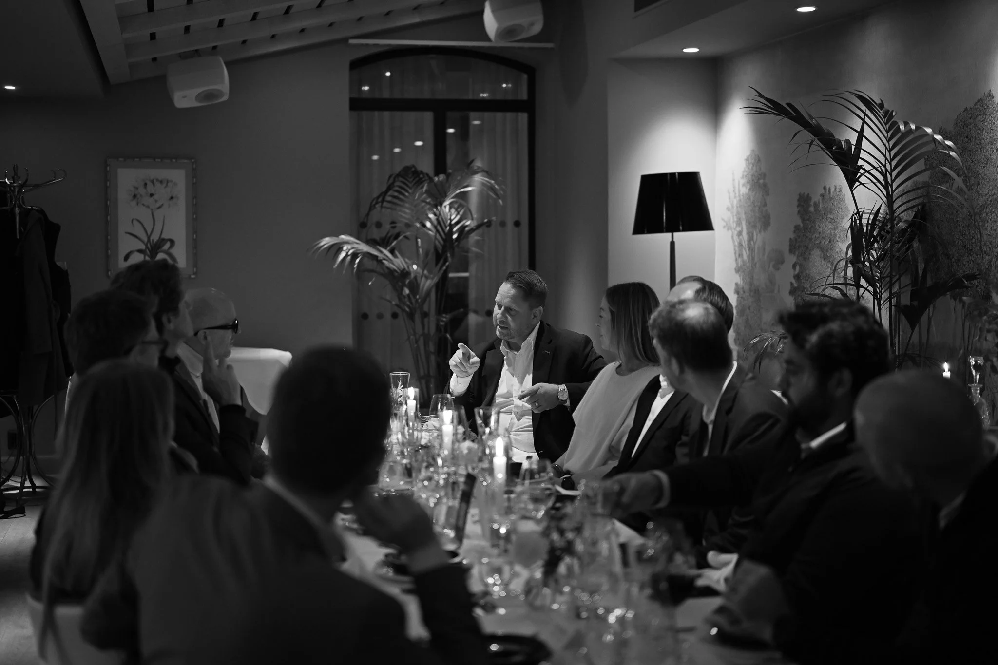 Host speaking to guests at an Ortus Club dinner in Stockholm