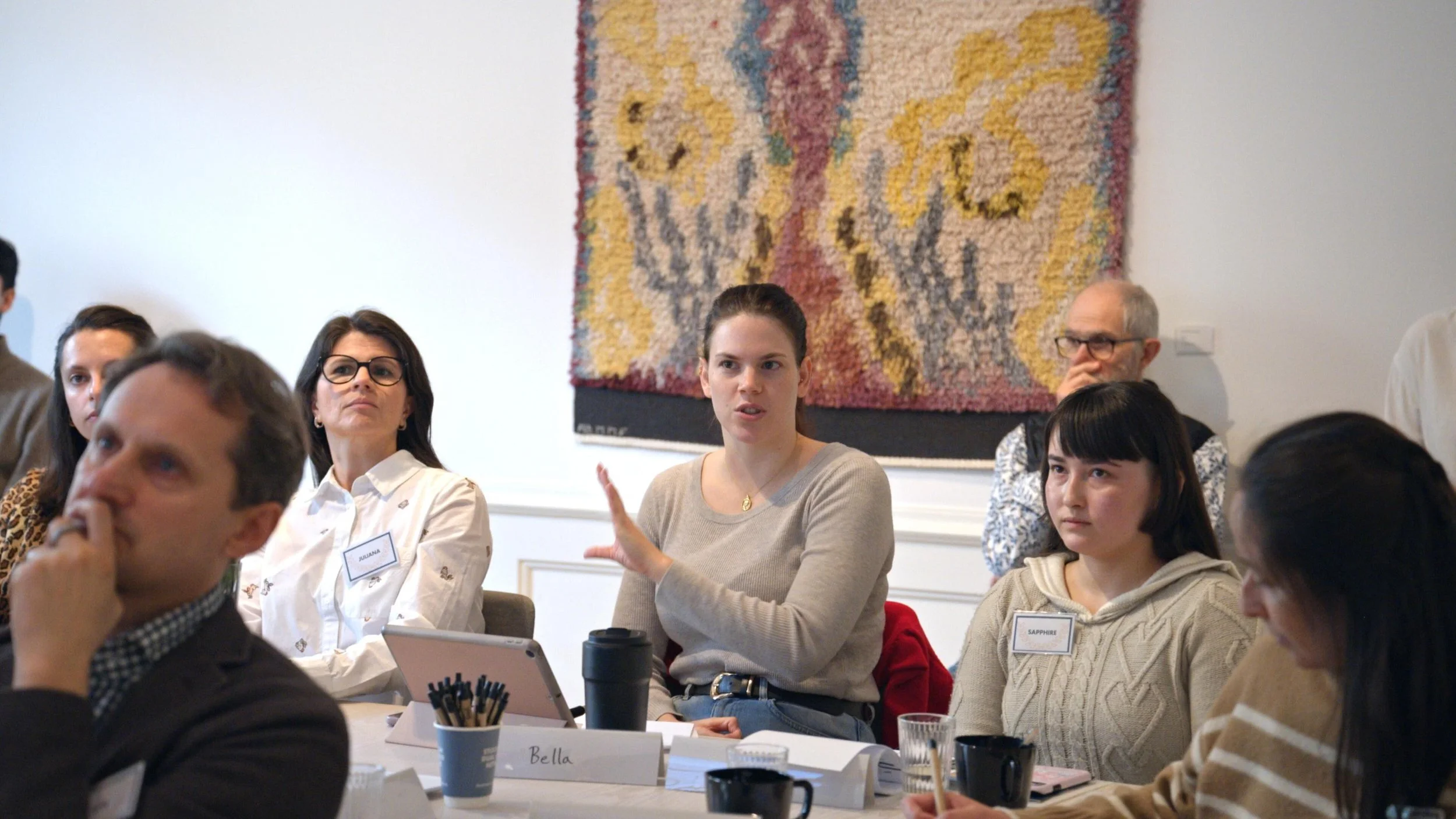 Participants discussing at a round table during the SDCN event in Stockholm