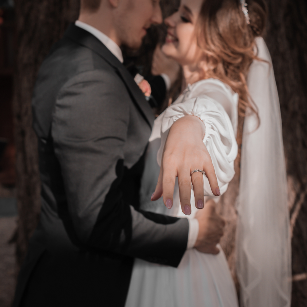 Bride and groom sharing a moment during an outdoor wedding
