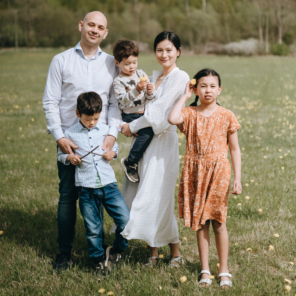 Family portrait of parents and children photographed outdoors in Stockholm