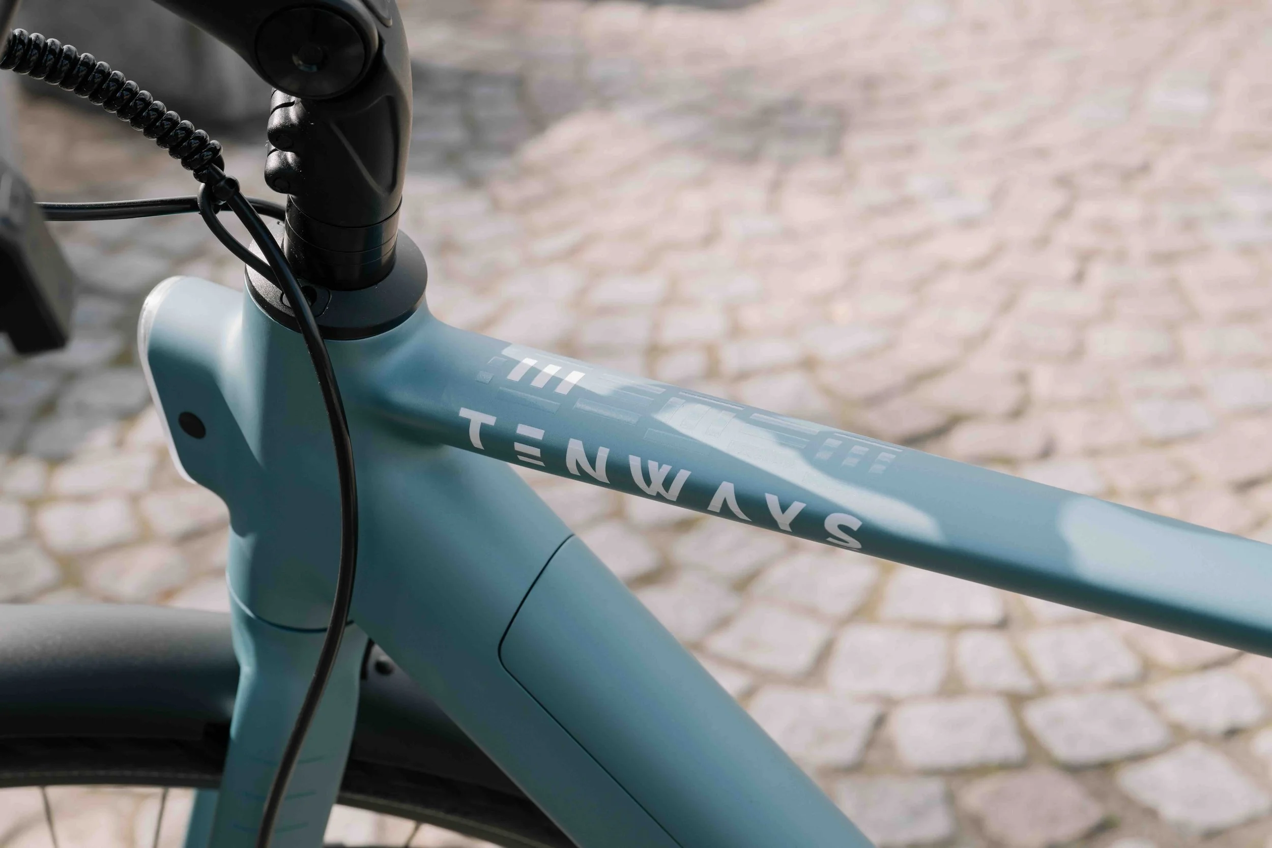 Close-up of a Tenways electric bike frame and branding