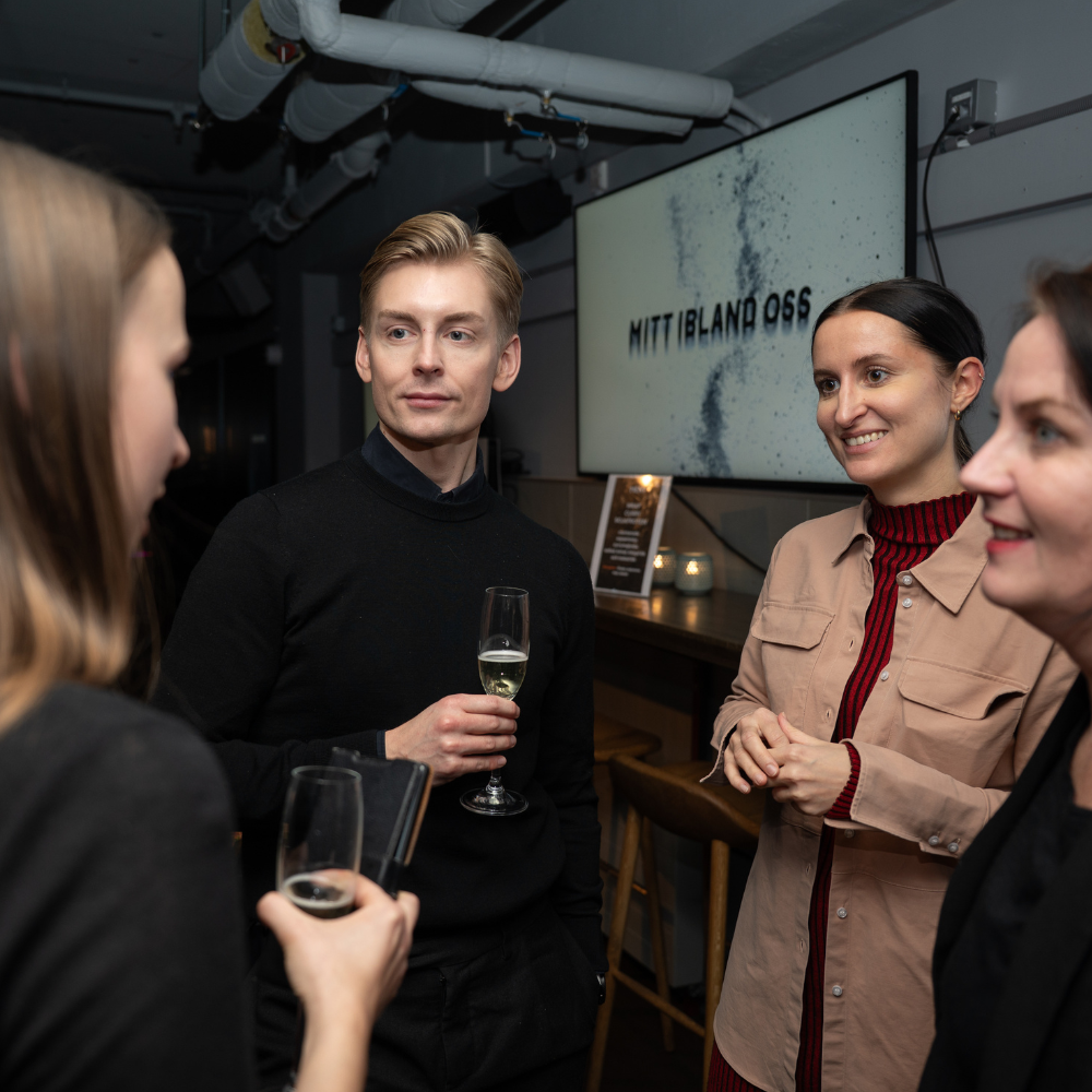 Guests networking at the Mitt Bland Oss book launch event in Stockholm