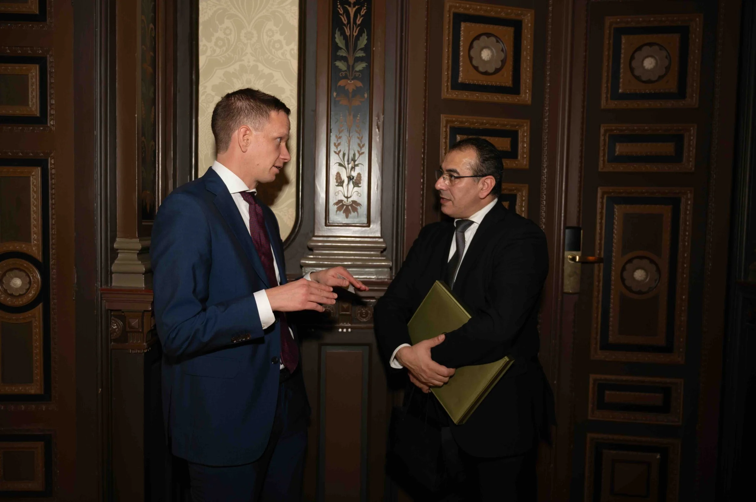 Two delegates talking during the Dubai Chamber inauguration event in Stockholm