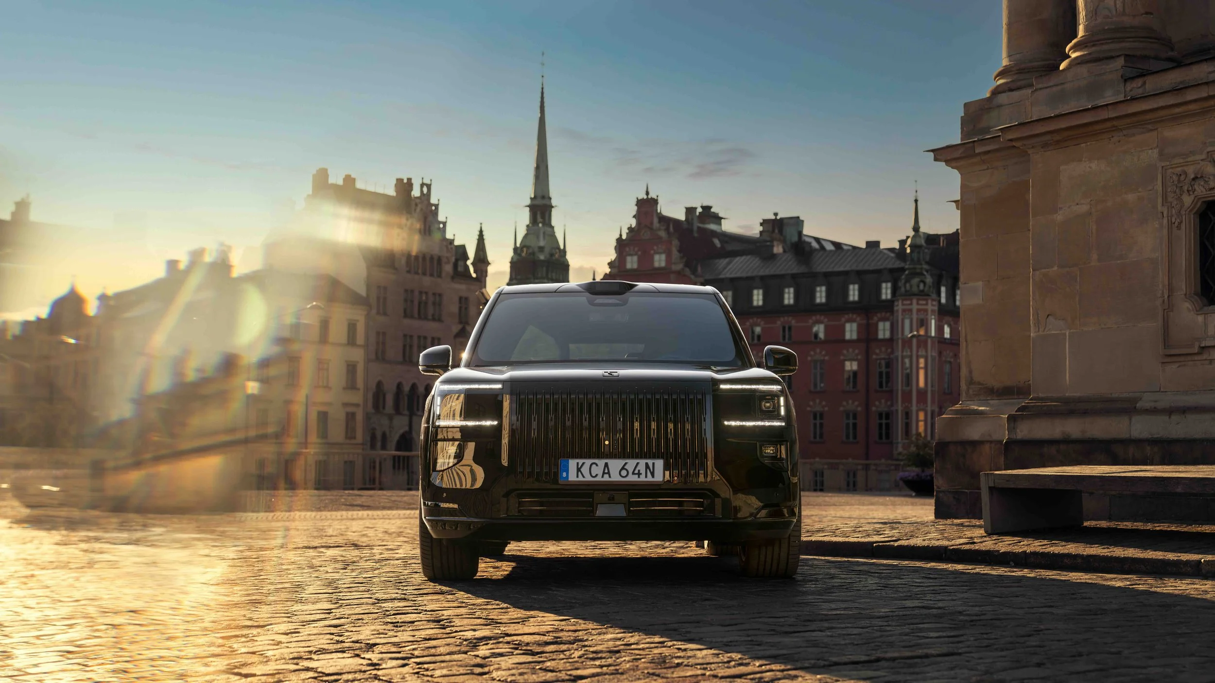 Black ZEEKR SUV photographed on a cobblestone street in Stockholm, Sweden