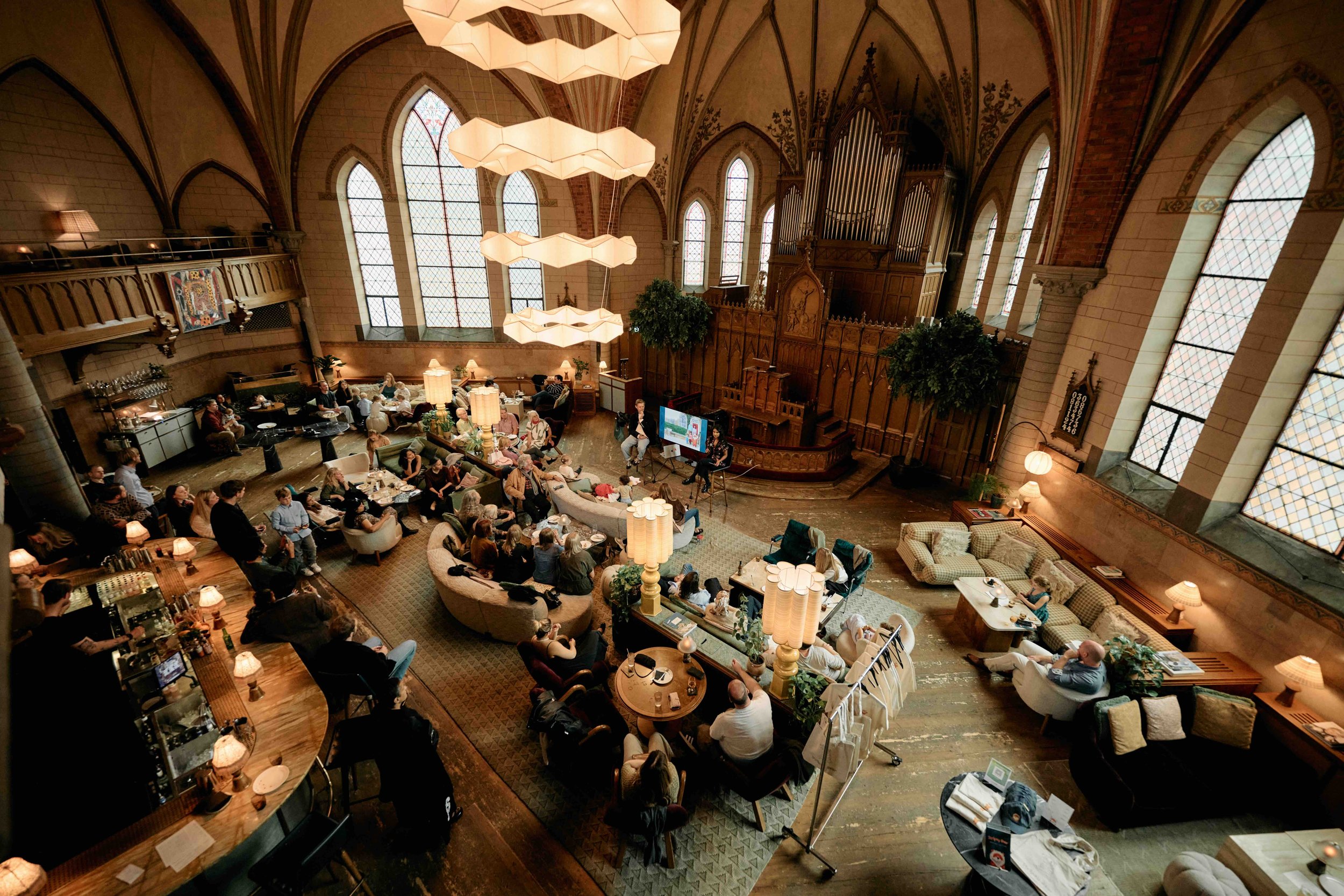 A wide view of the Stripey Bear — Where Are You From? book launch party at Soho House Stockholm, with guests gathered in the venue’s distinctive former church interior.