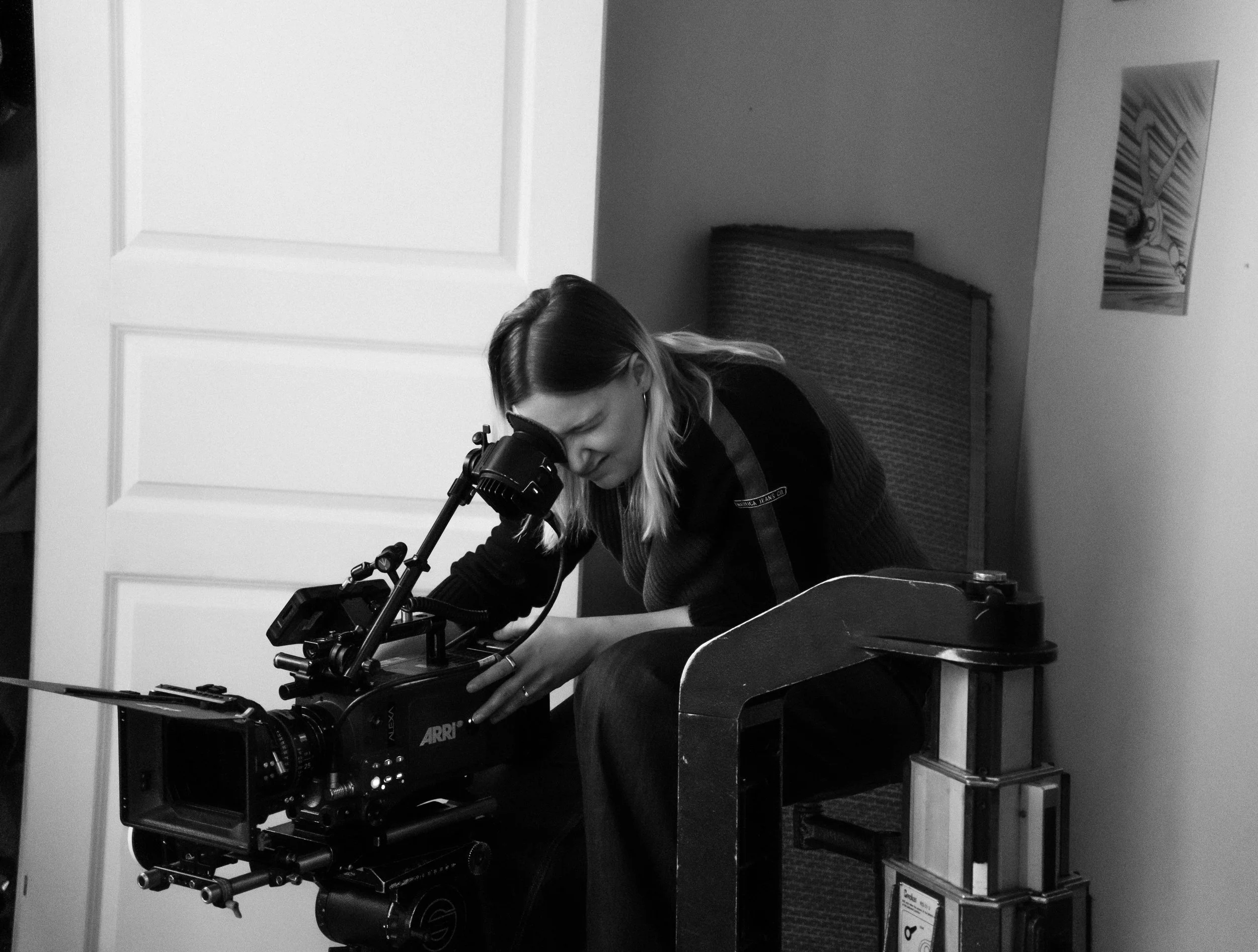 Wilma Wickström operating a professional cinema camera on set
