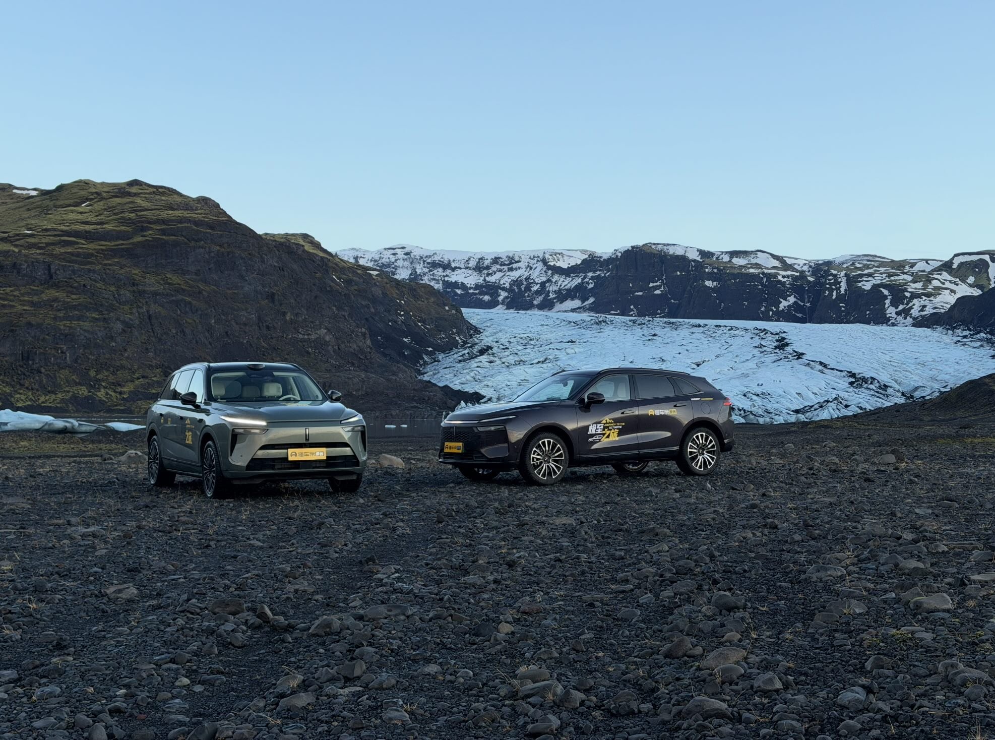 Two WEY electric vehicles photographed in front of a glacier in Iceland