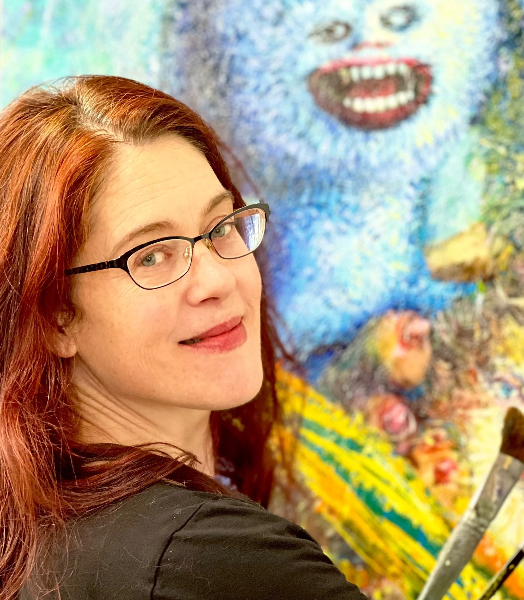 feminist surrealist painter amy swartele in the studio painting Angel and Cookie Monster.