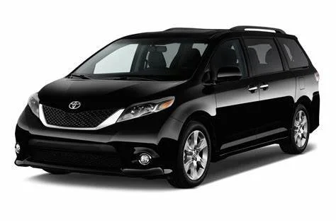 Black Toyota minivan on a white background