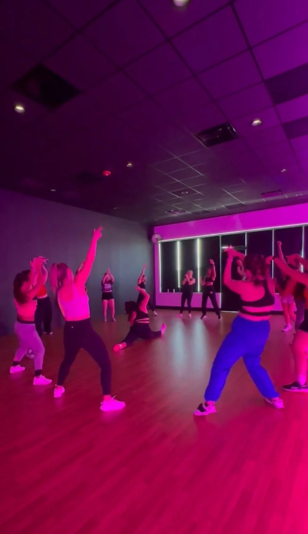 Group of women dancing together in a circle at Pulse Dance Fitness Studio private party in Des Moines Iowa