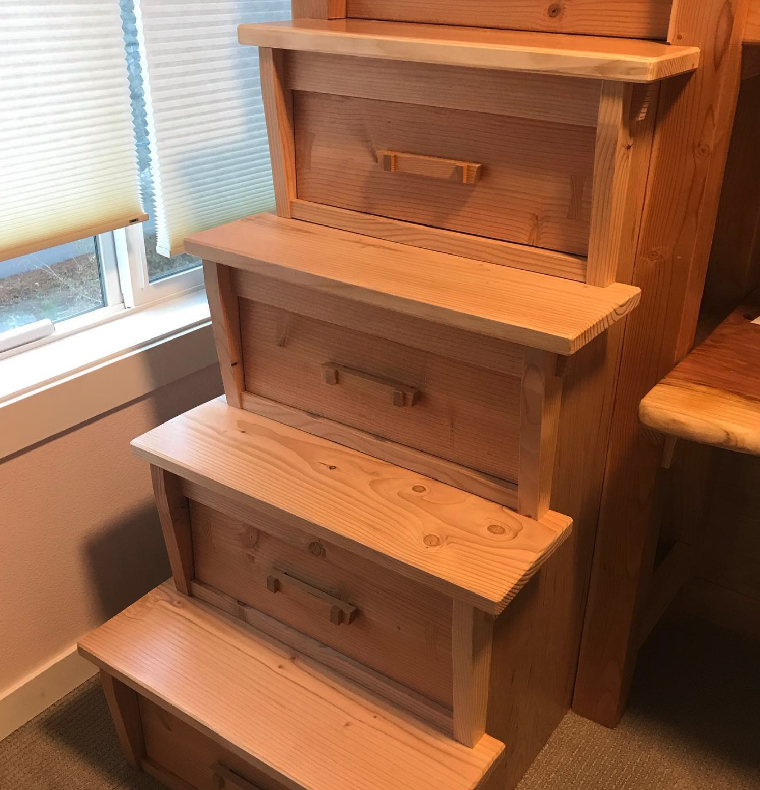Loft steps with built-in drawers.