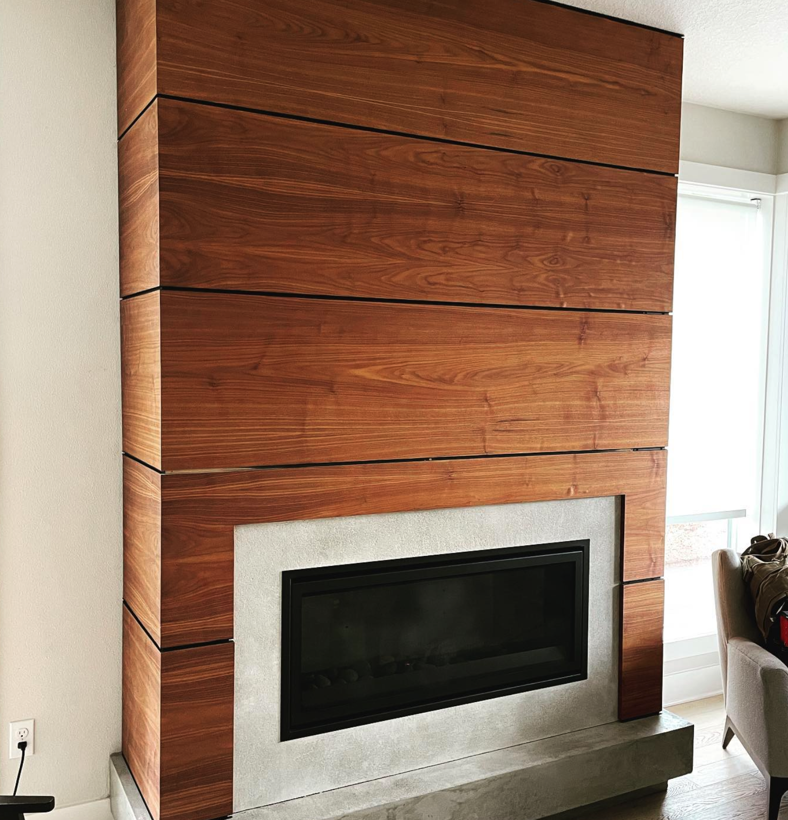 Walnut and concrete fireplace