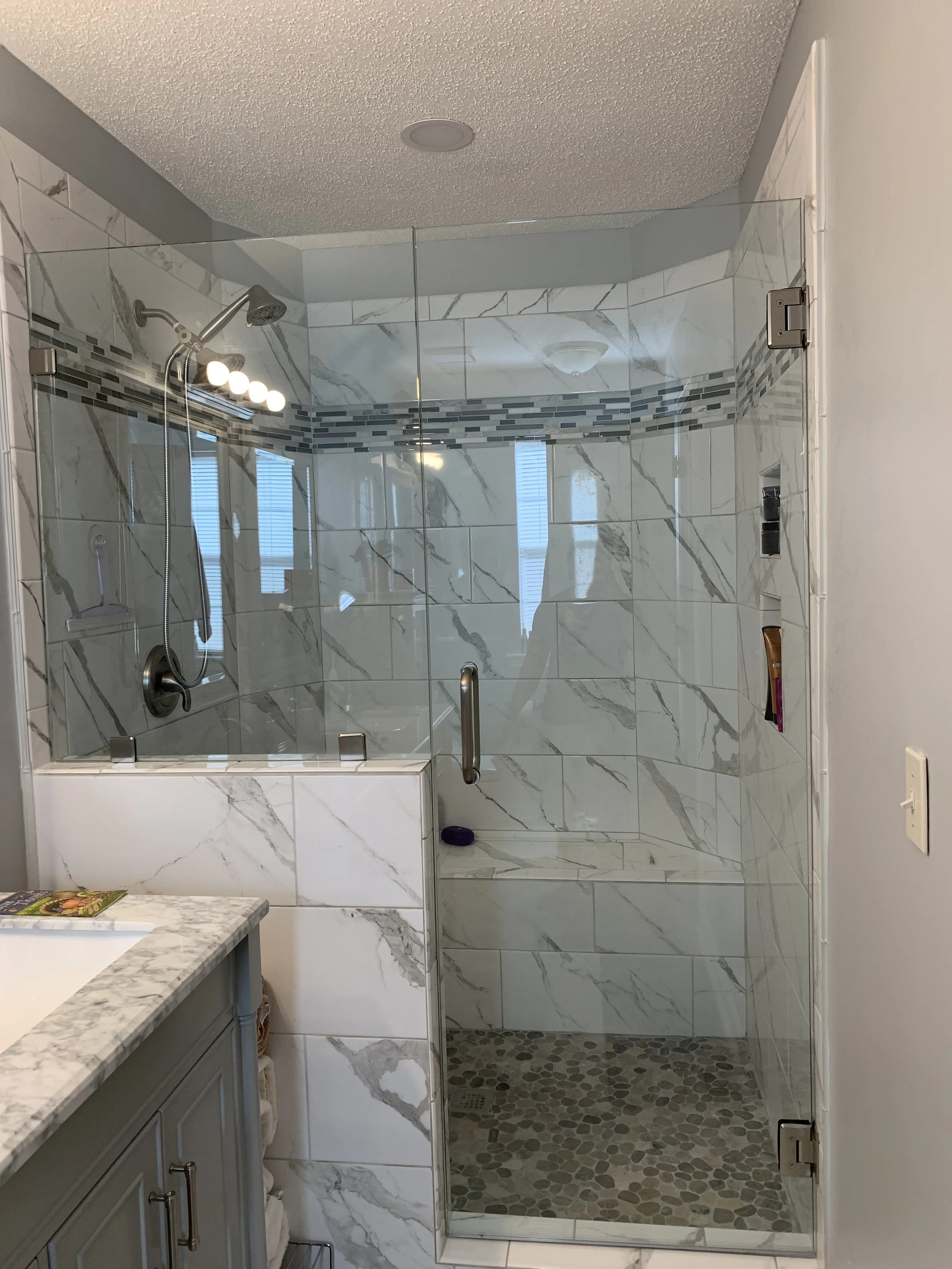 marble-tile-shower-remodel-glass-door