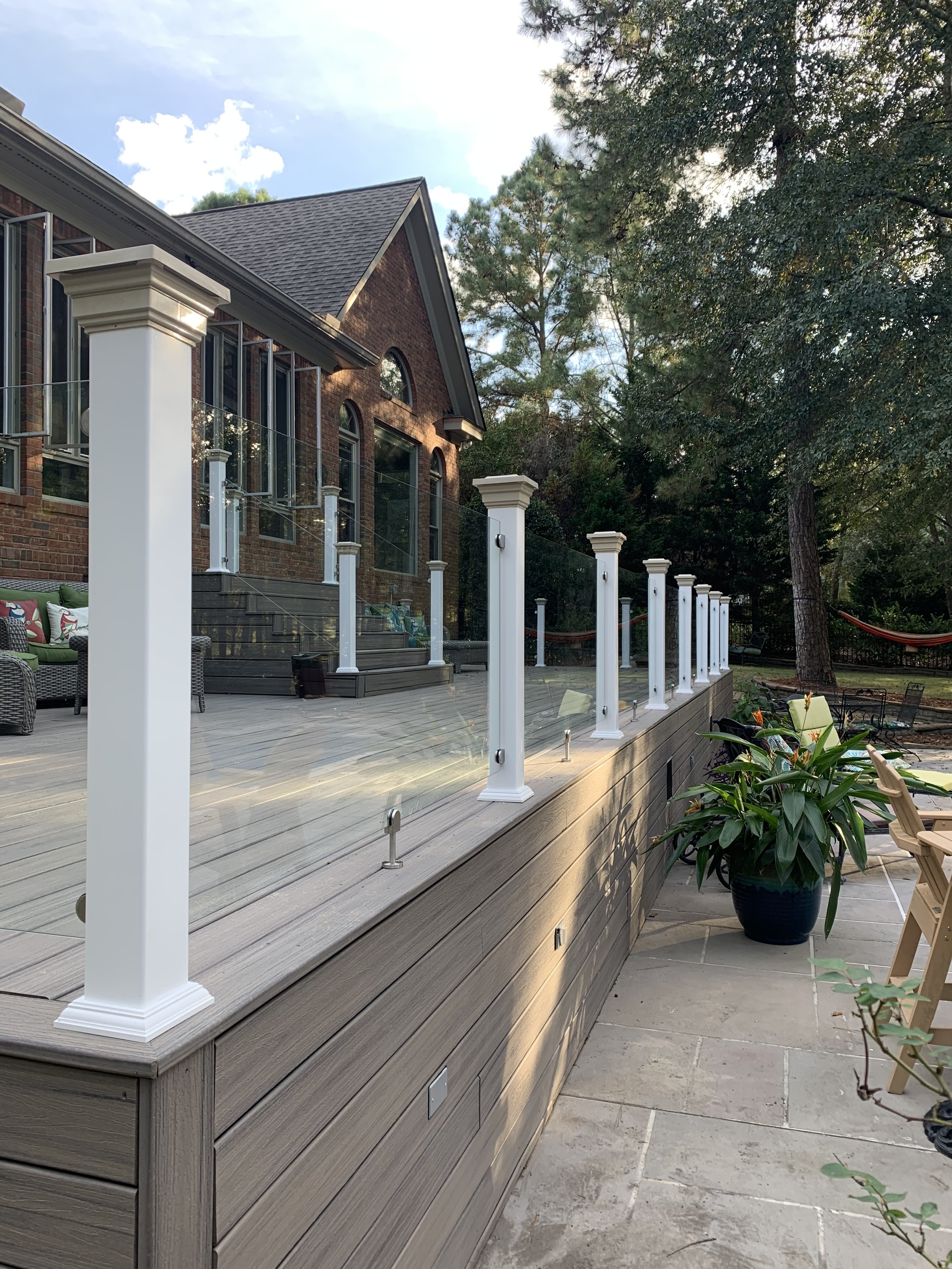 white-column-glass-railing-porch-renovation