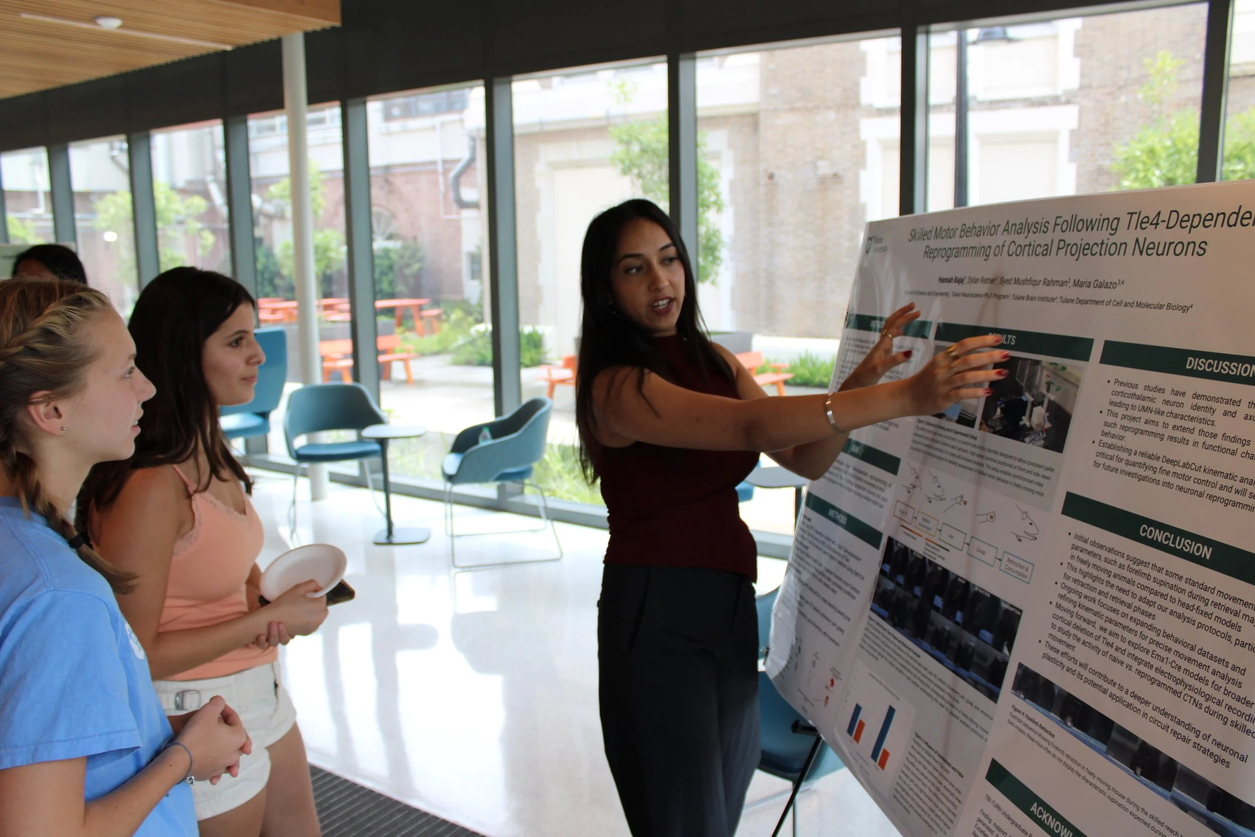Hannah Bajaj presenting her poster at the T.U.R.N summer poster presentation 2025