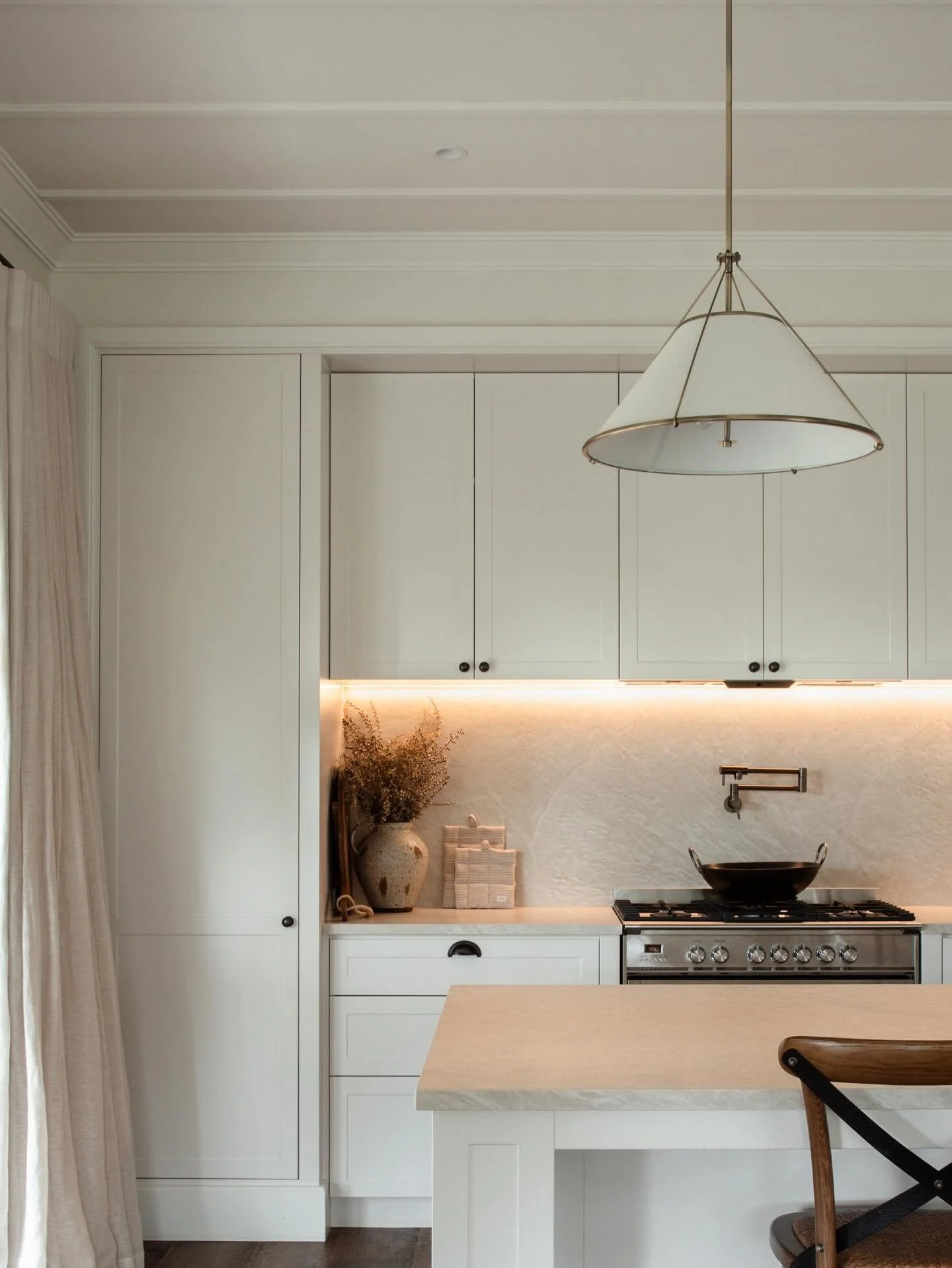 Project Tuhimata 
Traditional charm, soft elegance, and warm inviting tones are layered throughout this kitchen. Thoughtfully connected to the living spaces, with a bar wrapping seamlessly from the coffee station, perfect for entertaining and effortl