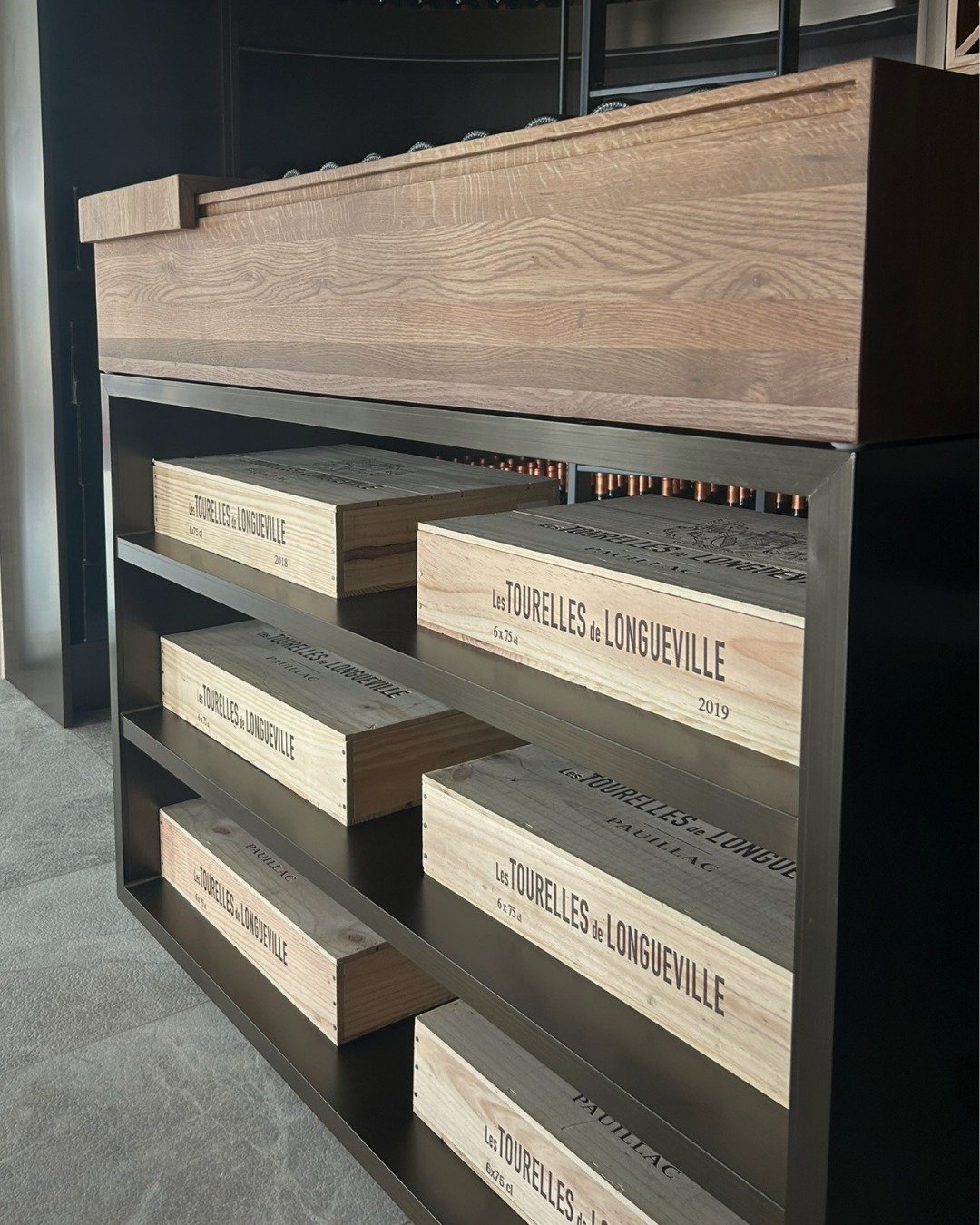 Project - Eastern Bays Wine Cellar embellishments 

A customized rolling ladder becomes both a functional tool and a statement piece - celebrating the scale of the space while ensuring every bottle remains within reach.
At the heart of the wine cella