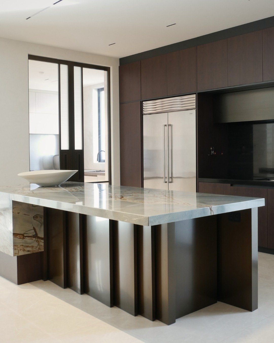 Project - Eastern Bays 
The story behind the kitchen island

The front of the Island carries a deep narrative. A series of fins represent each family member who will inhabit the home over time - a gesture that moves beyond design into storytelling. E
