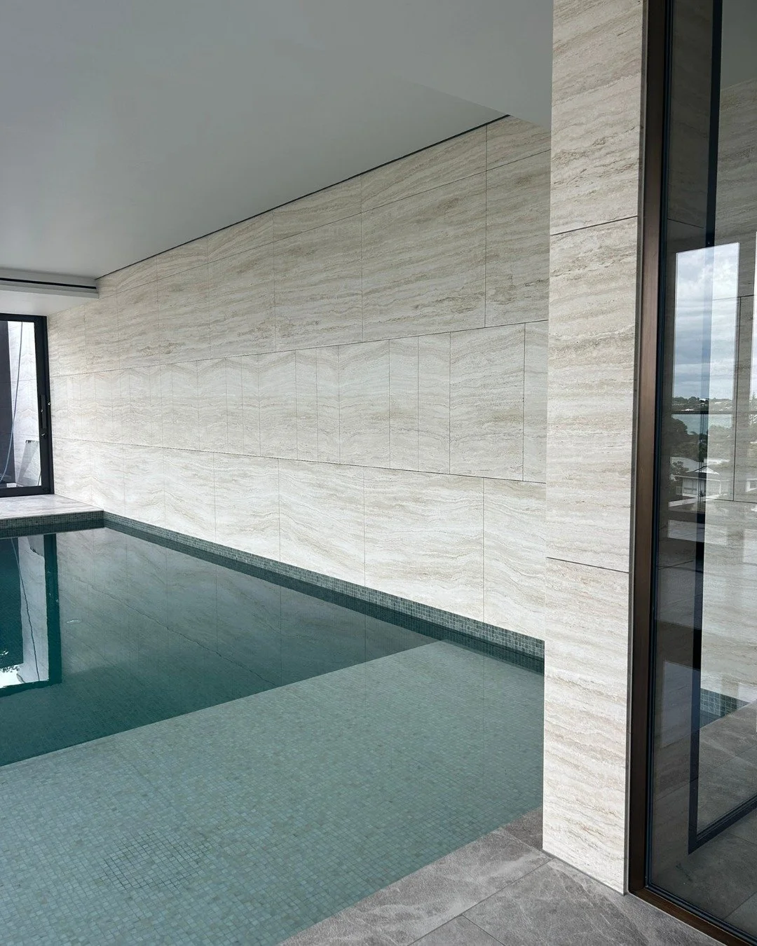 Project Eastern Bays - Swimming pool and beyond

When the client trusts you enough to redefine the design intent of their indoor pool, opportunities emerge.

In reworking the material palette, we realised the space outside the pool had been under-con