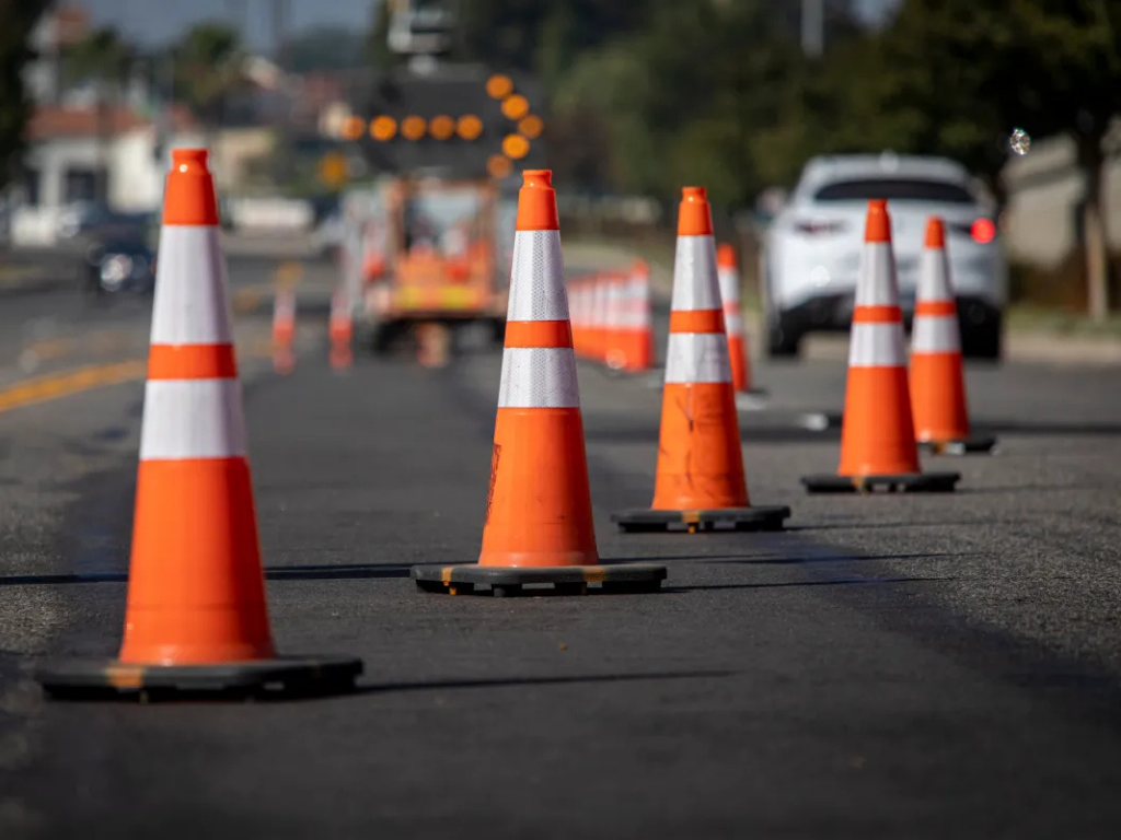 Orange traffic cones on a road indicating construction or roadwork.