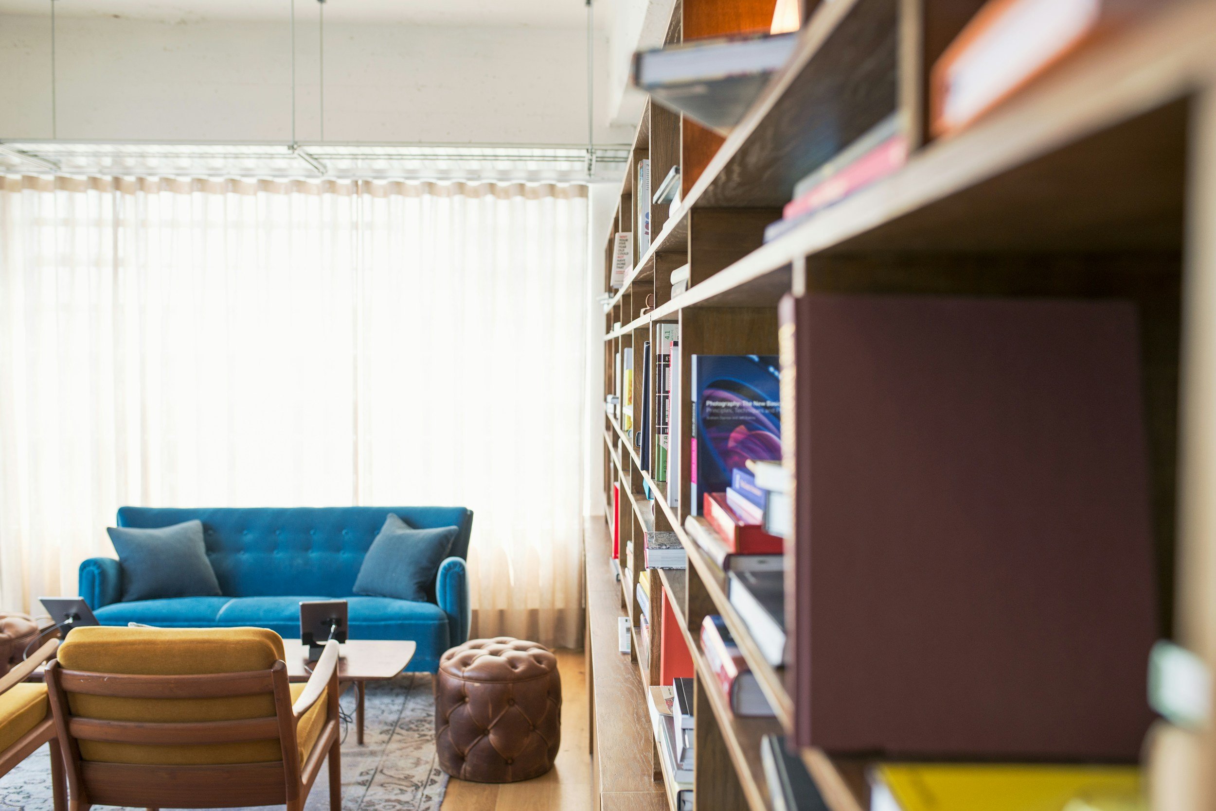 living room divided by bookshelf